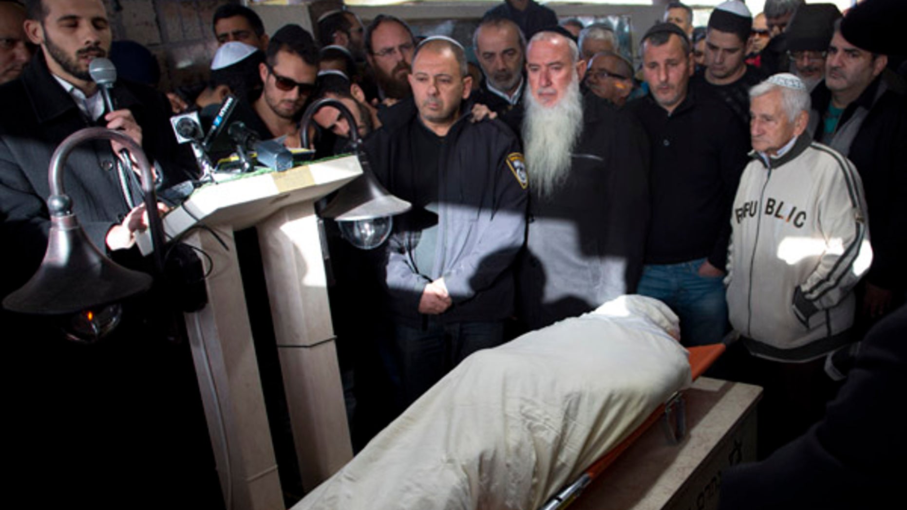 Jan. 3, 2016: Relatives and friends of Shimon Ruimi mourn during his funeral in the southern Israeli town of Ofakim. Ruimi, 30, was killed when a gunman opened fire outside a bar on a main street in Tel Aviv on Friday afternoon.