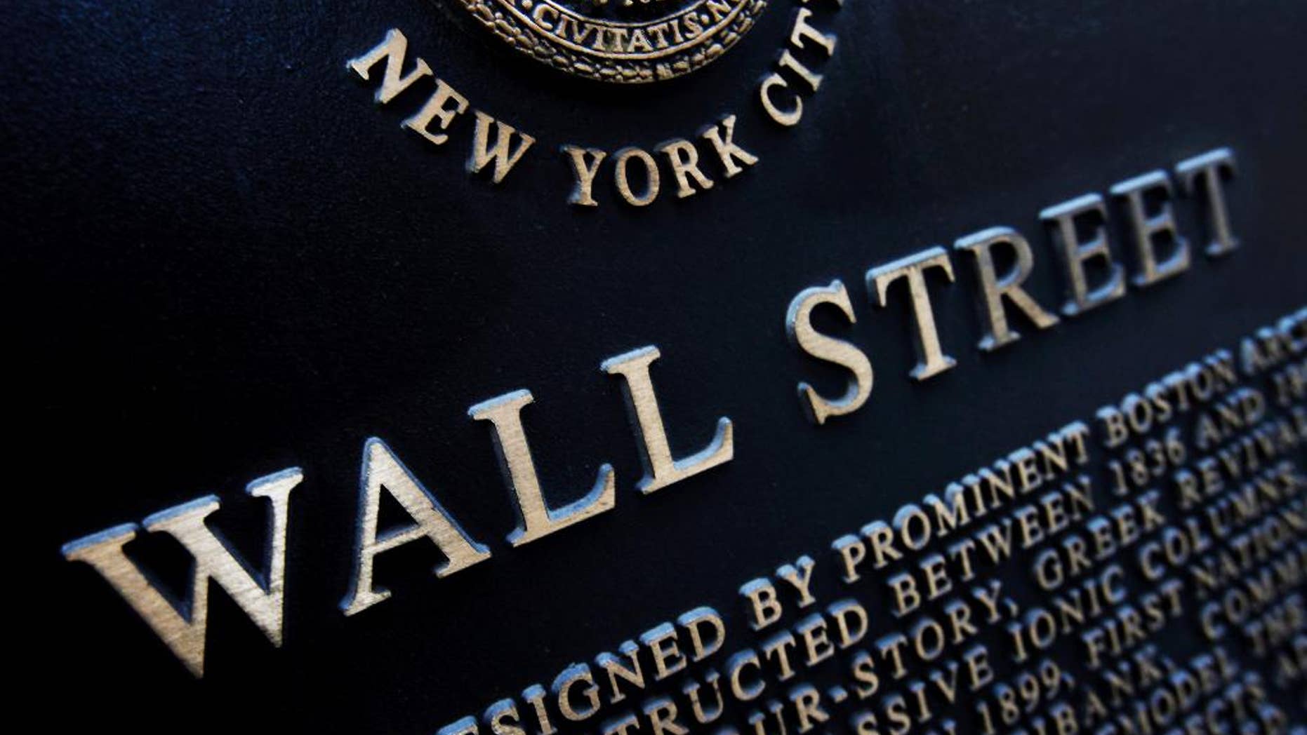 FILE - This Jan. 4, 2010 file photo shows an historic marker on Wall Street in New York. Japan's stock benchmark closed above the 20,000-level for the first time in 15 years Wednesday, April 22, 2015, encouraged by the country's first monthly trade surplus since 2012. European stocks fell, however, and Wall Street was expected to open lower. (AP Photo/Mark Lennihan, File)