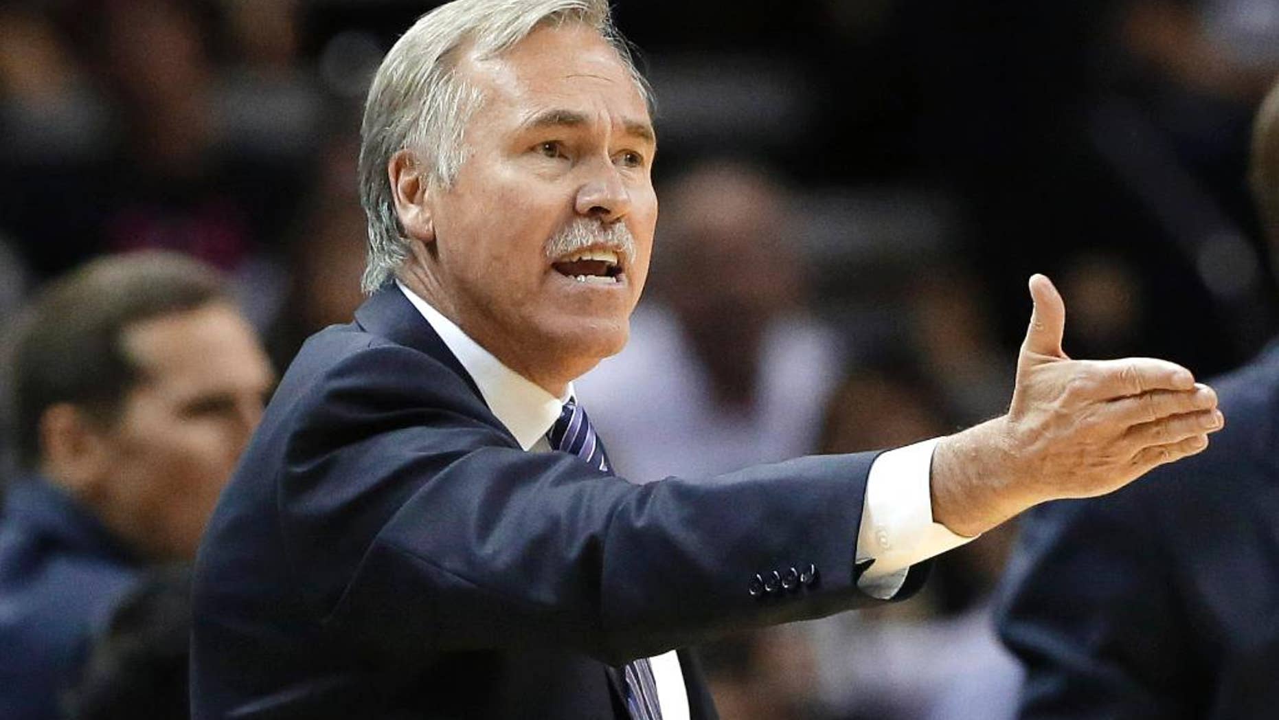 Los Angeles Lakers head coach Mike D'Antoni argues a call during the second half of an NBA basketball game against the San Antonio Spurs, Wednesday, April 16, 2014, in San Antonio. Los Angeles won 113-100. (AP Photo/Eric Gay)