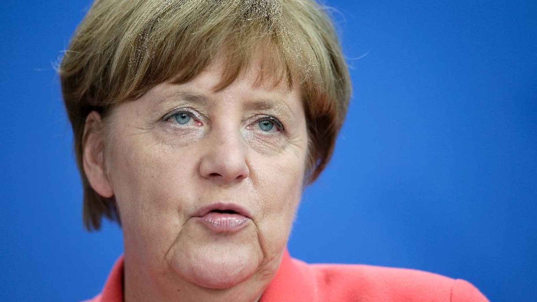 German Chancellor Angela Merkel addresses the media during a joint press conference with NATO Secretary General Jens Stoltenberg as part of a meeting at the chancellery in Berlin, Germany, Thursday, June 2, 2016. (AP Photo/Michael Sohn)