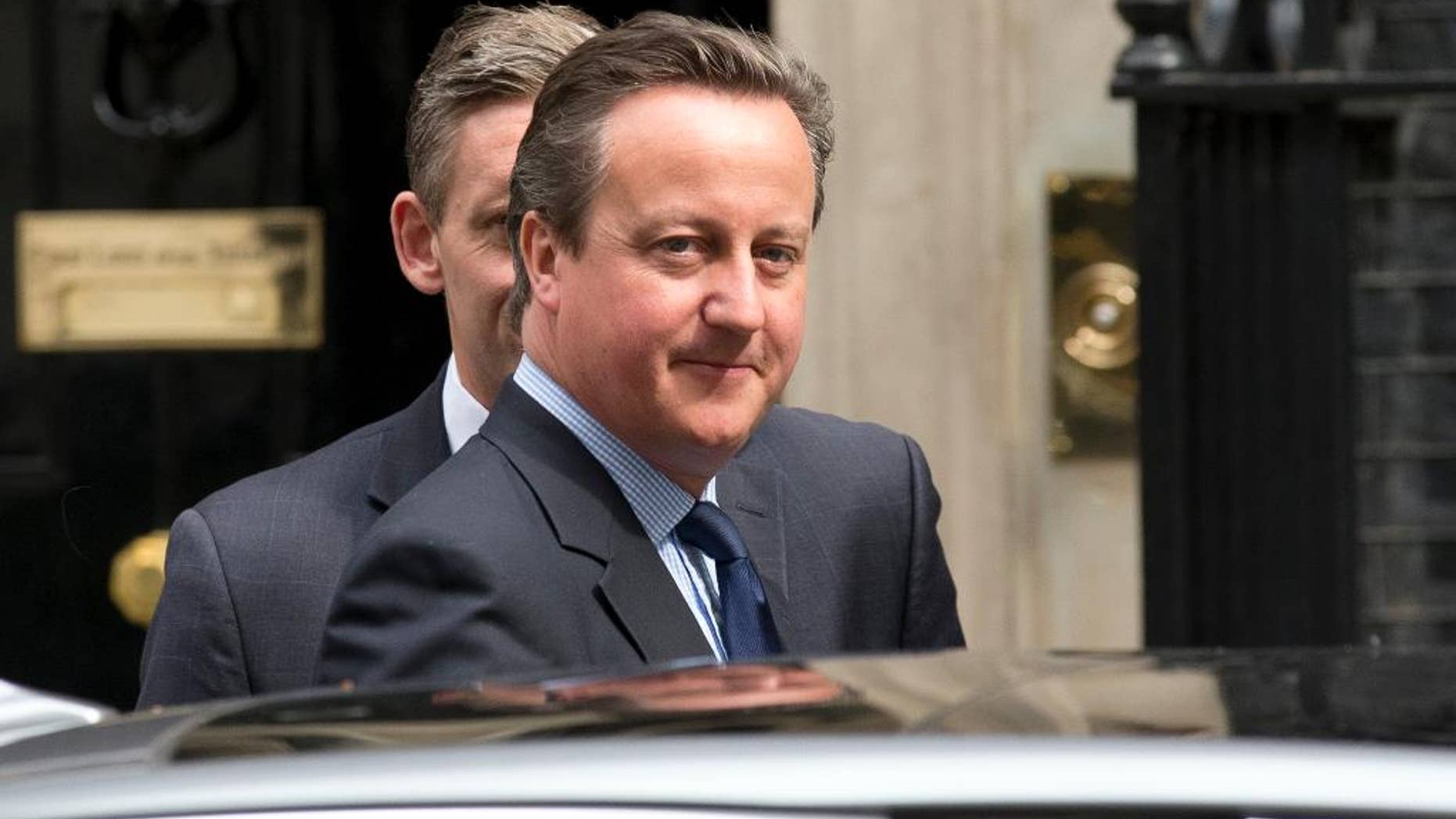 British Prime Minister David Cameron leaves from 10 Downing Street in London, to attend Prime Minister's Questions at the Houses of Parliament, Wednesday, June 8, 2016. (AP Photo/Matt Dunham)
