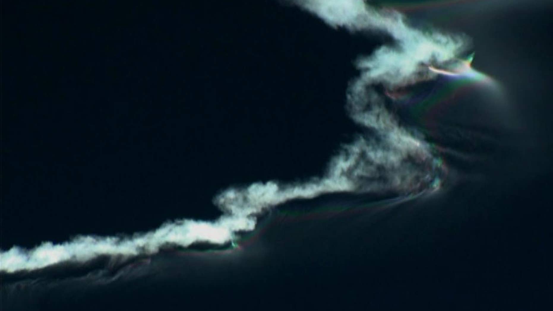 FILE - In this Sept. 13, 2012 file image from video provided by ABC15 in Phoenix, the contrail of a Juno ballistic missile fired from Fort Wingate near Gallup, N.M., reflects early morning sunlight high above New Mexico. Authorities across the Southwest are preparing to be inundated with calls and emails from people who might catch a glimpse of the contrail from an early morning missile test Thursday, Dec. 10, 2015. (ABC15 via AP, File)
