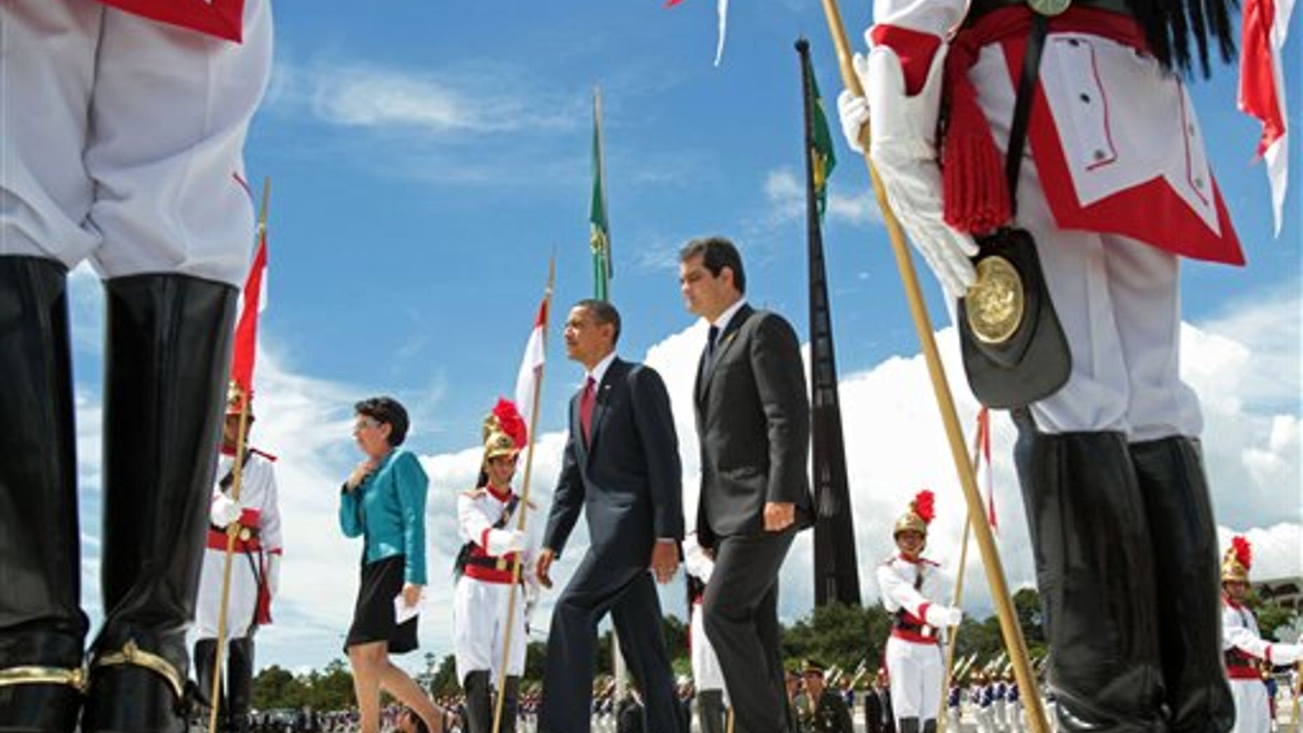 U.S. President Barack Obama, center, arrives to Planalto palace in Brasilia, Brazil, Saturday March 19, 2011. Obama arrived in Brazil on Saturday for the start of a three-country, five-day tour of Latin America. (AP Photo/Eraldo Peres)