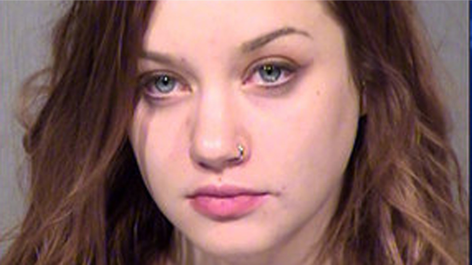 Lauren Tamburrelli was booked on suspicion of drunken driving and murder in the deaths of two during an auto crash.