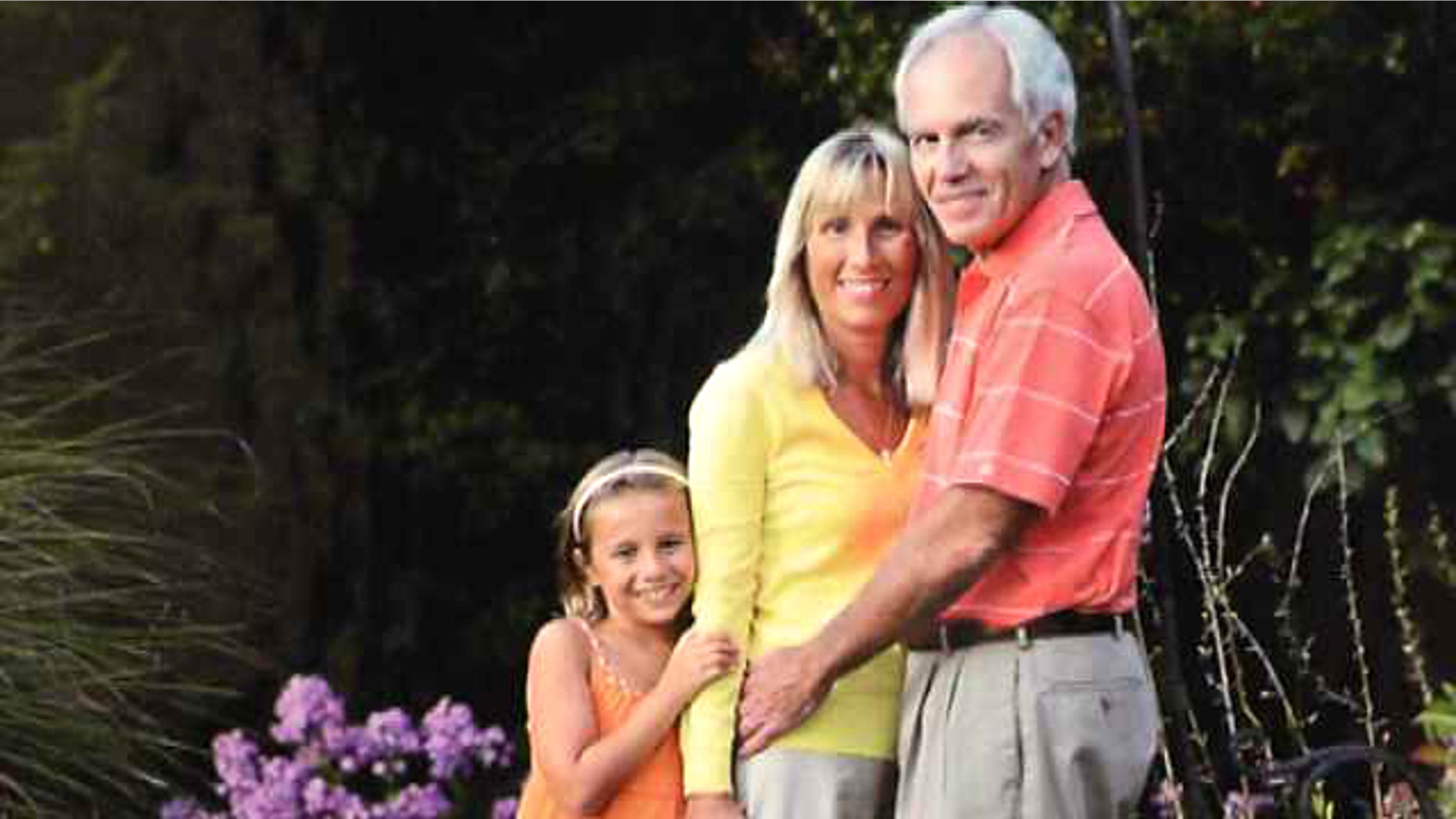Karlene Novotny is pictured with her husband Steve, and their biological granddaughter Ava who they recently adopted.
