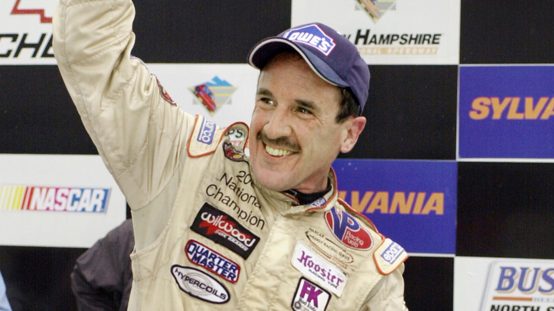In this Sept. 16, 2005 file photo, Ted Christopher celebrates his victory in the Busch North Series Sylvania 125 at the New Hampshire International Speedway in Loudon, N.H.