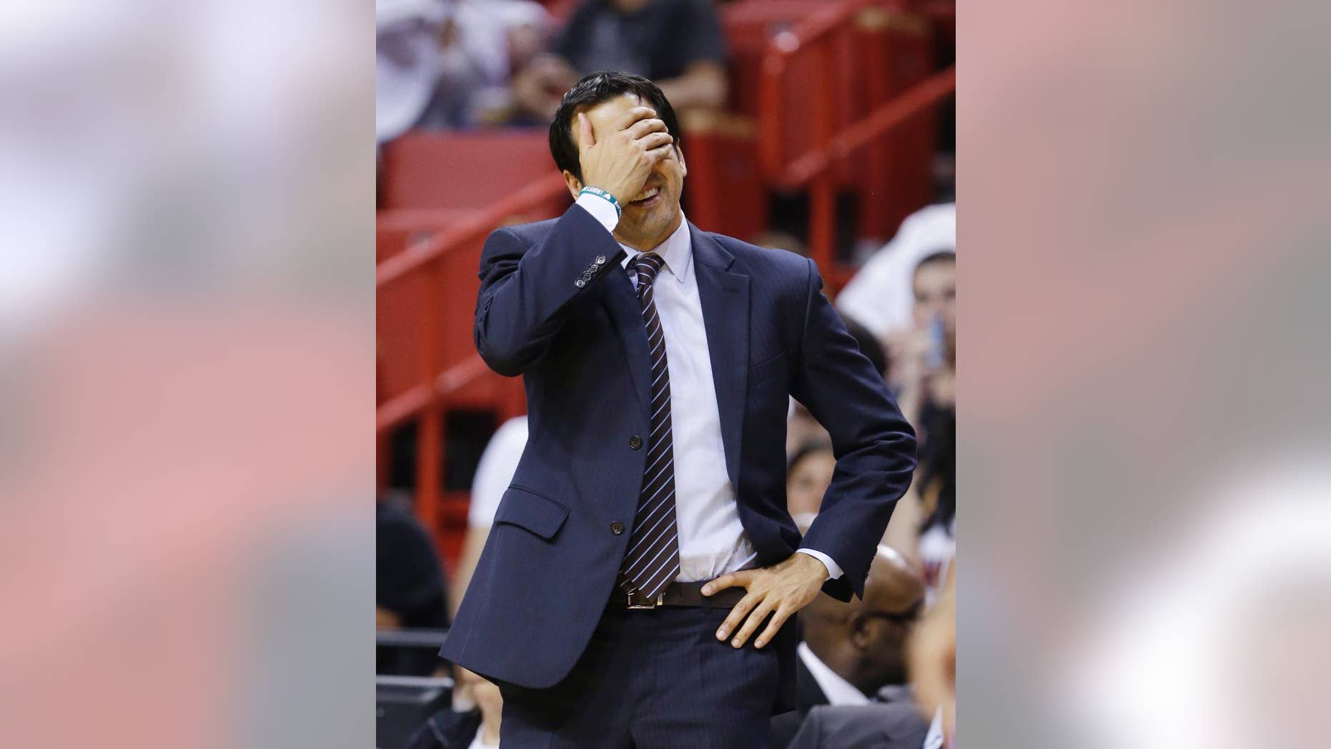 Miami Heat head coach Erik Spoelstra reacts after a call during the second half of an NBA basketball game against the Philadelphia 76ers, Wednesday, April 16, 2014 in Miami. The 76ers defeated the Heat 100-87. (AP Photo/Wilfredo Lee)