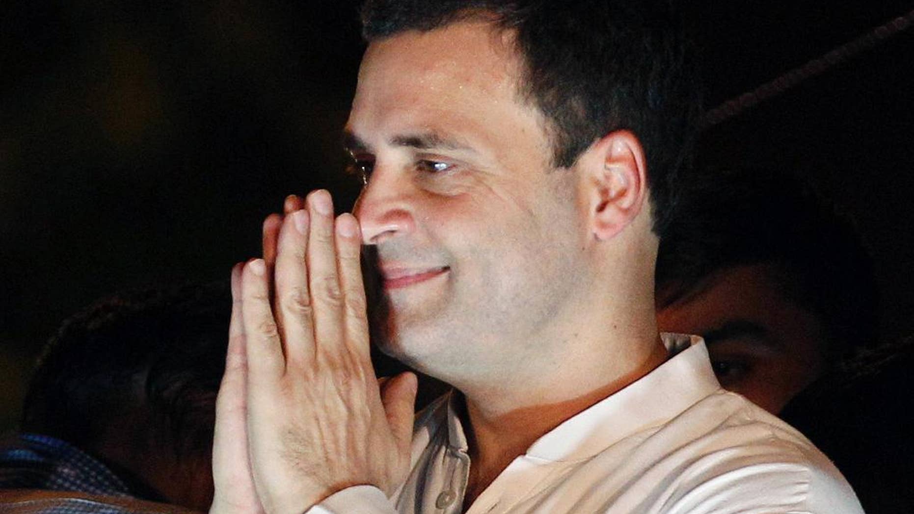 FILE - In this May 28, 2016, file photo, India's opposition Congress party vice-president Rahul Gandhi, greets his supporters during a protest rally against the Aam Aadmi Party or Common Man's Party led Delhi government and India's ruling Bharatiya Janata Party government over power cuts and water shortage in New Delhi, India. India's top court on Tuesday, July 19, 2016, has ordered a scion of India's Nehru-Gandhi family to express regret or face defamation charges for blaming the country's top Hindu nationalist organization for the 1948 assassination of independence leader Mohandas Gandhi. (AP Photo/Altaf Qadri, File)
