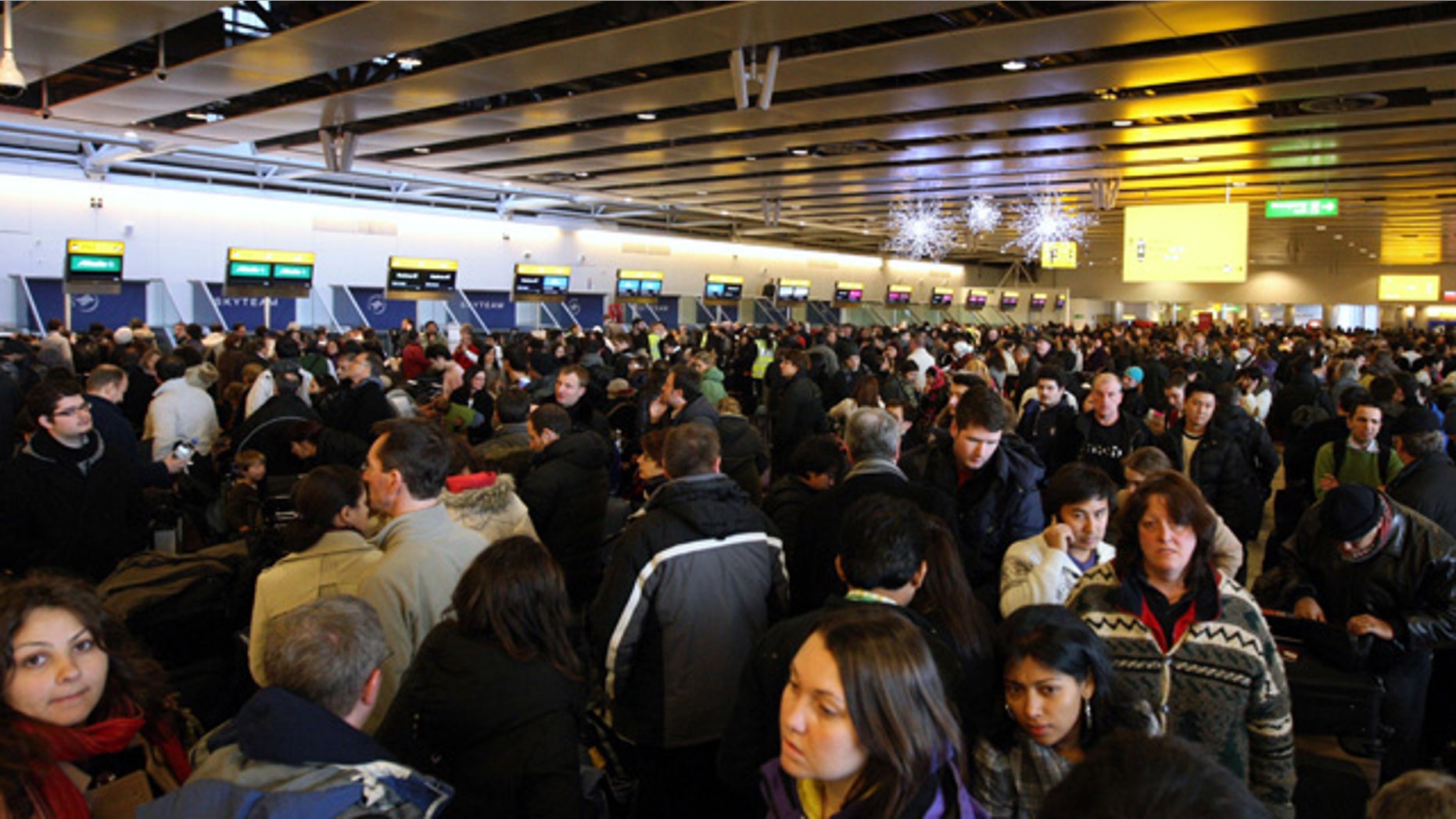 Dec. 20: Passengers wait for their flights, which were disrupted by snow and freezing temperatures, inside Terminal 4 at London's Heathrow Airport. (AP)