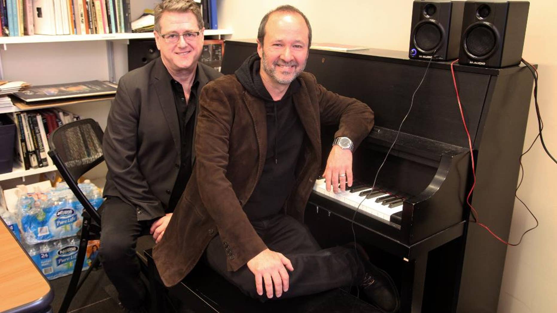 This April 30, 2015 photo shows playwright Robert L. Freedman, left, and composer Steven Lutvak in New York. The duo co-wrote the Tony Award-winning musical "A Gentleman's Guide to Love and Murder” and are being honored by their alma mater, New York University's Tisch School of the Arts. (AP Photo/Mark Kennedy)