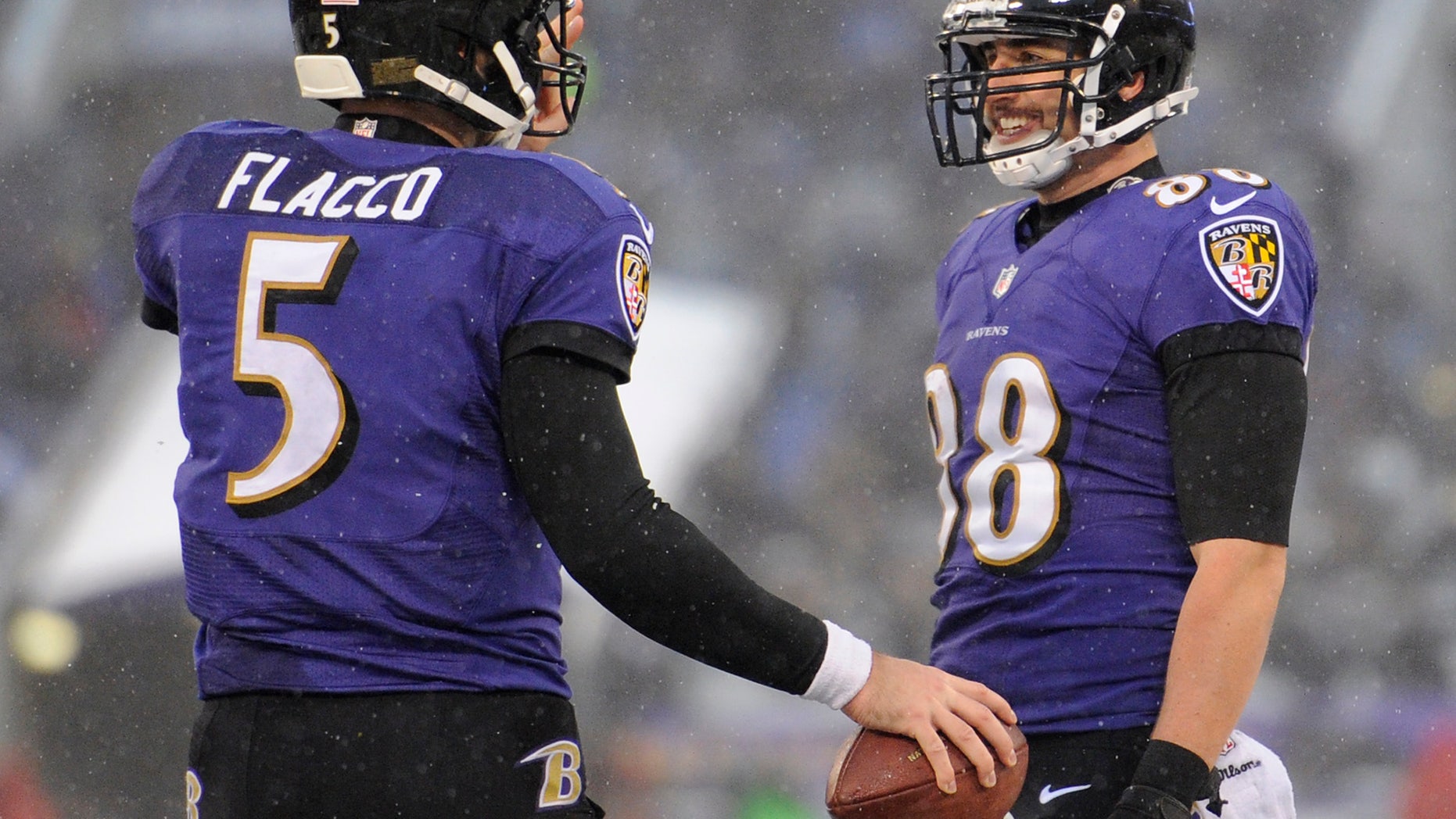 Baltimore Ravens tight end Dennis Pitta, right, celebrates his touchdown with quarterback Joe Flacco in the second half of an NFL football game against the Minnesota Vikings, Sunday, Dec. 8, 2013, in Baltimore. Baltimore won 29-26. (AP Photo/Nick Wass)