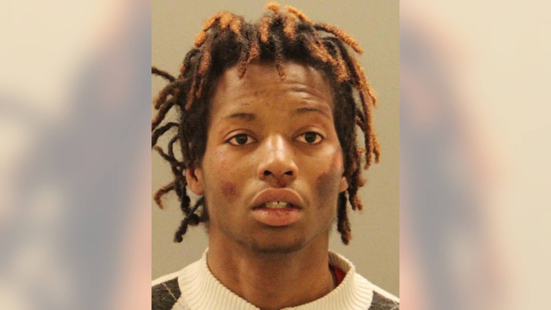 This photo provided by the New Castle County Police shows Dion Brown, who's charged with second-degree assault of a police officer, resisting arrest with force and criminal mischief. New Castle County Police said in a statement Wednesday, May 3, 2017, that officers responded Tuesday to a report of a man soliciting door-to-door in Newark with a gun in his bag and stopped Brown of Newton, Idaho. When officers tried to take Brown into custody, police said he fought them. (New Castle County Police via AP)