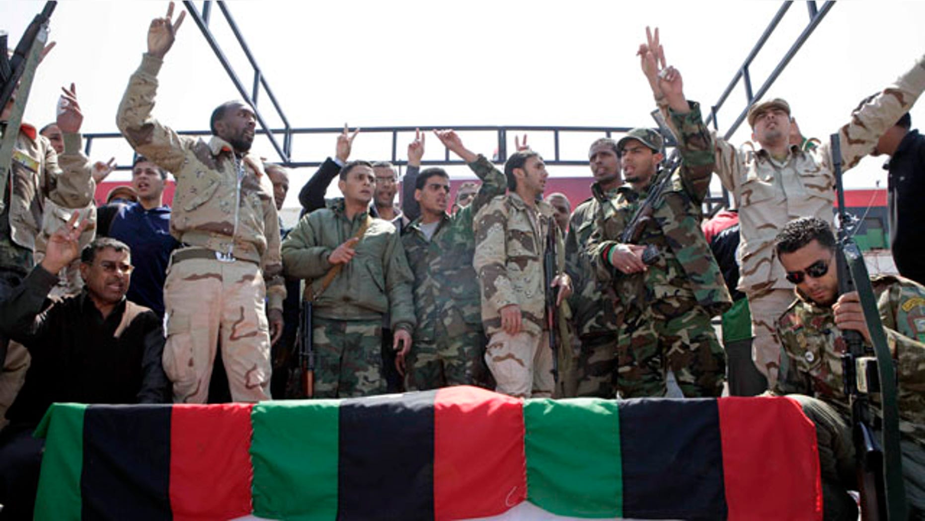 April 19: Libyan rebels surround the coffin of a comrade, whom they say was killed by forces loyal to Mouammar al-Qaddafi in Brega, during a funeral in Benghazi.