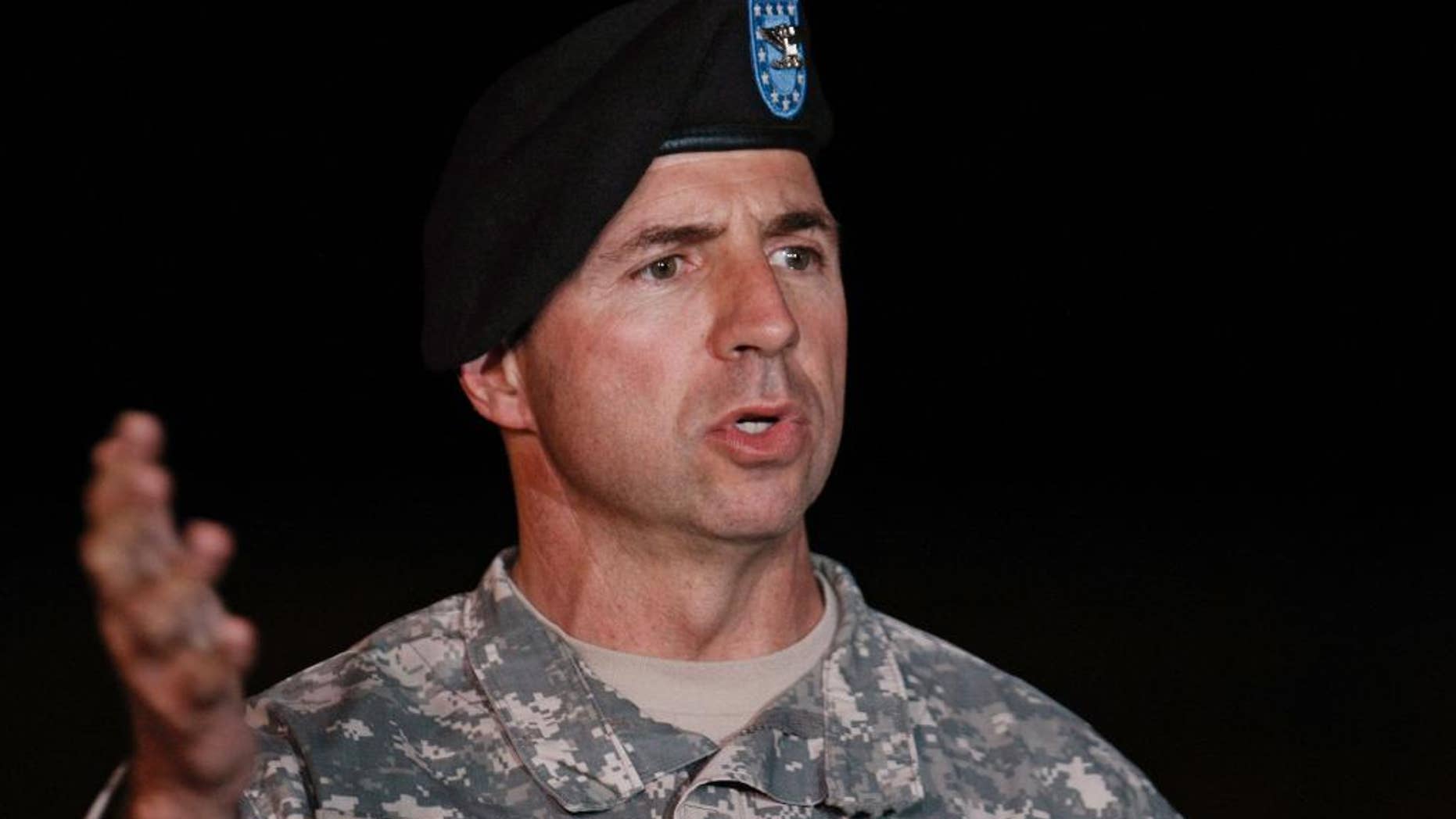 FILE - In this Nov. 7, 2009 file photo, then-Col. John Rossi speaks at a news conference at Fort Hood headquarters in Killeen, Texas. The Army says the death of a two-star general on a military base in Alabama has been ruled a suicide. Rossi was found dead July 31, 2106, in his home on Redstone Arsenal, and an investigation was undertaken. (AP Photo/Paul Sakuma, File)