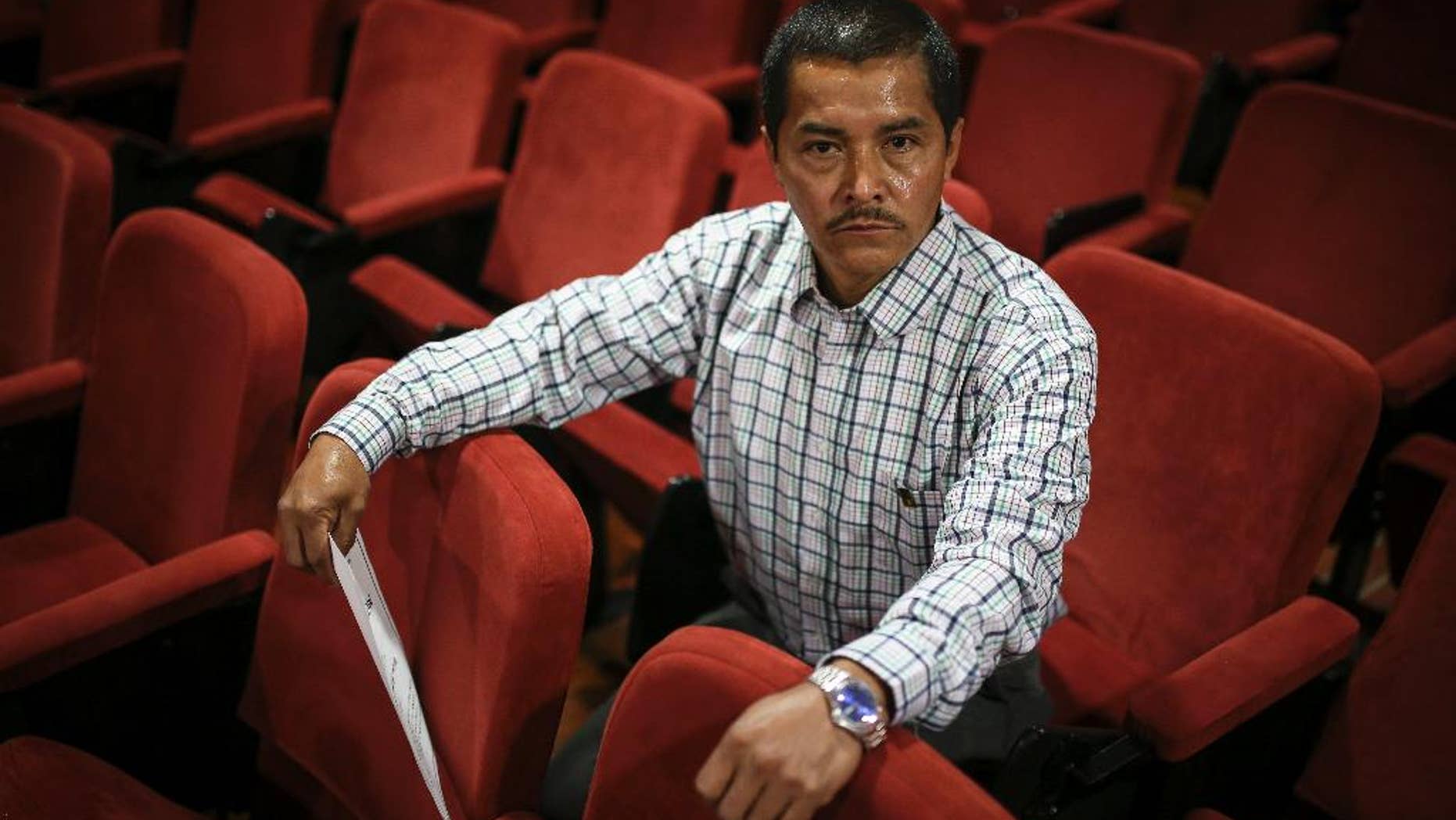 In this Dec. 10, 2016 photo, Wilson Lopez, a former rebel of the Revolutionary Armed Forces of Colombia, FARC, poses for a photo at a distance learning institution after receiving his elementary school diploma, in Bogota, Colombia. The ex-guerrilla says he’s been hit with death threats since getting out of jail and trying to start life as a civilian, a snapshot of what awaits thousands of FARC rebels in rejoining society under Colombia’s peace pact. (AP Photo/Ivan Valencia)