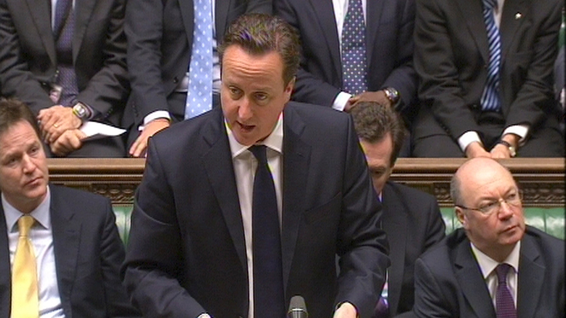 Britain's Prime Minister David Cameron speaking to the House of Commons in London in this image taken from TV Friday Jan. 18, 2013, where the prime minister spoke about the kidnap situation in Algeria. (AP Photo/PA) UNITED KINGDOM OUT