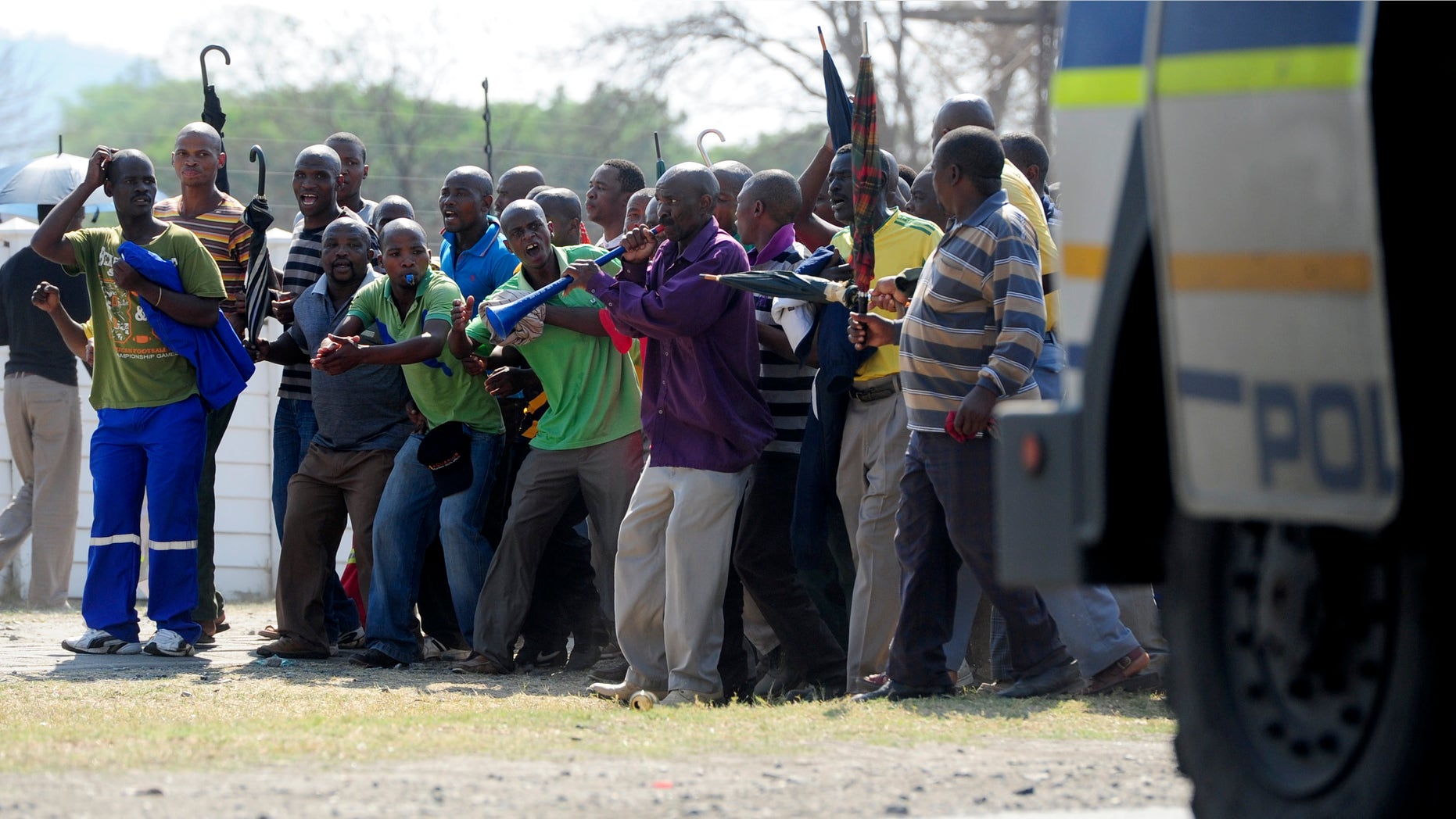 Striking mineworkers take part in a demonstration in Rustenburg, South Africa, Saturday Oct. 6 2012. A leader for striking miners at Anglo American Platinum mines in South Africa said they would make it difficult for the company to hire new miners after the company fired some 12,000 striking workers earlier this week. (AP Photo/Str)