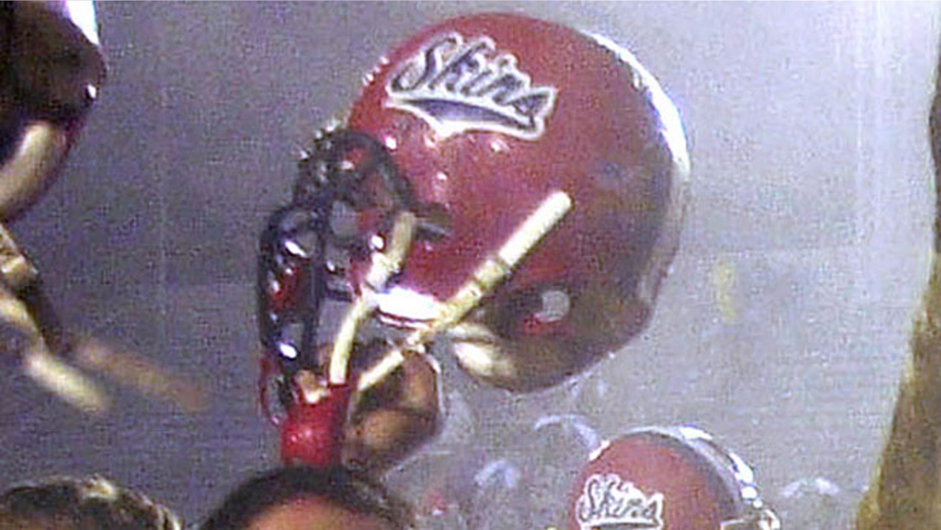 In this Dec. 8, 2001 file photo, Neshaminy teammates celebrate after their 21-7 victory over Woodland Hills to claim the Class AAAA state title in Hershey, Pa.