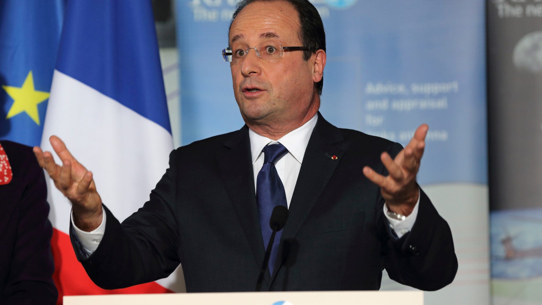 French President Francois Hollande, delivers a speech as he visits the Radiall engineering and coaxial connectors plant in Chateau-Renault, central France, Monday, Dec. 17, 2012. (AP Photo/Philippe Wojazer, Pool )