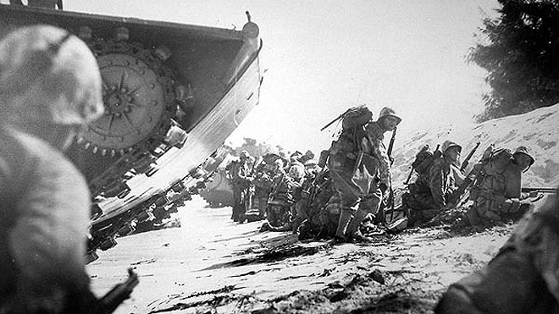 U.S. Marines land on Saipan Beach on June, 15 1944, when they attacked Japanese-held positions. Saipan is the largest island of the Northern Mariana Islands. (CNMI Historic Preservation Office)