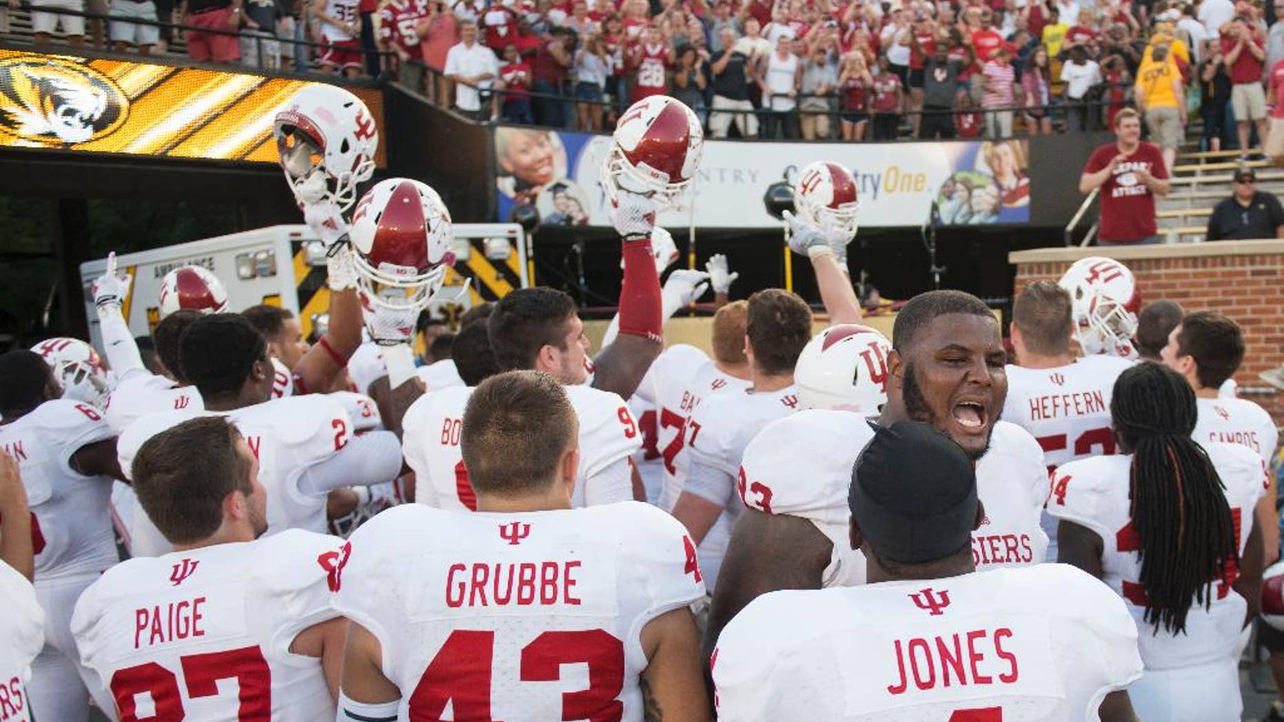 The Indiana football team celebrates in front of fans after Indiana upset Missouri, 31-27, in an NCAA college football game Saturday, Sept. 20, 2014, in Columbia, Mo. (AP Photo/L.G. Patterson)