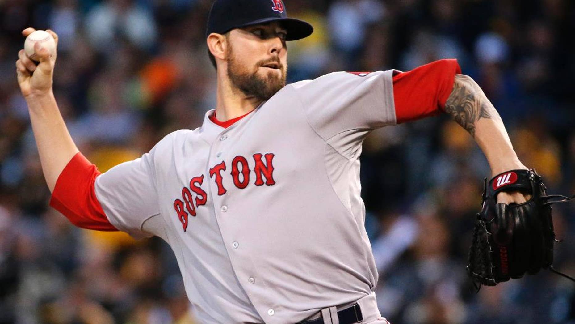 Boston Red Sox starting pitcher Anthony Ranaudo delivers during the first inning of a baseball game against the Pittsburgh Pirates in Pittsburgh Tuesday, Sept. 16, 2014. (AP Photo/Gene J. Puskar)