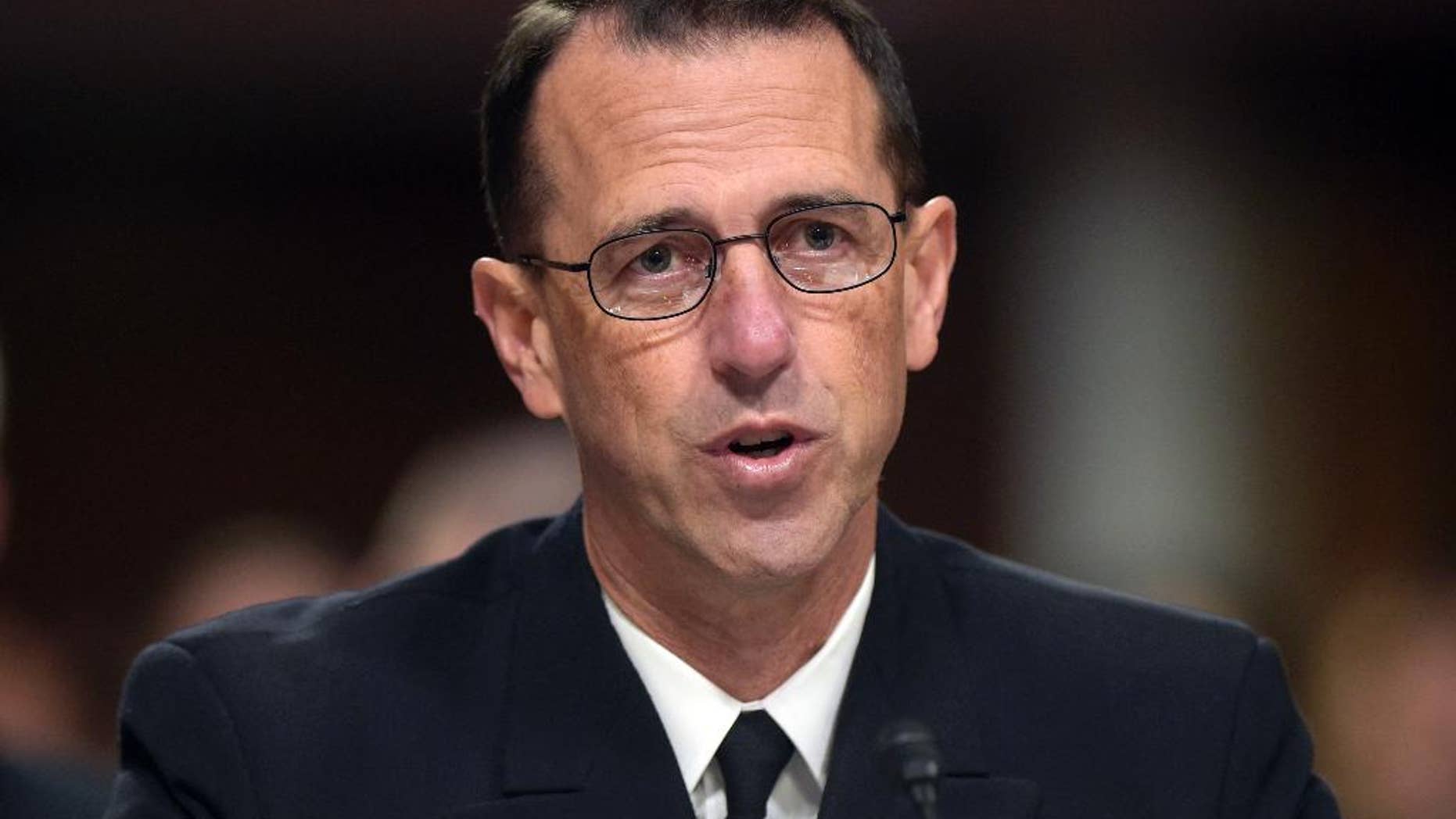 FILE - In this Sept. 15, 2016, file photo, U.S. Chief of Naval Operations Adm. John Richardson testifies on Capitol Hill in Washington. The U.S. Navy is scrapping its decision to eliminate dozens of enlisted sailors’ job titles, including many that end in “man,” after hitting an onslaught of opposition from the force. The decision to drop long-held traditional titles and instead refer to sailors by their rank was announced in September and signaled a sharp cultural shift for the Navy. Richardson, the chief of naval operations, said in a memo that modernizing the job ratings or titles was designed to give sailors more flexibility in training and assignments. (AP Photo/Susan Walsh, File)