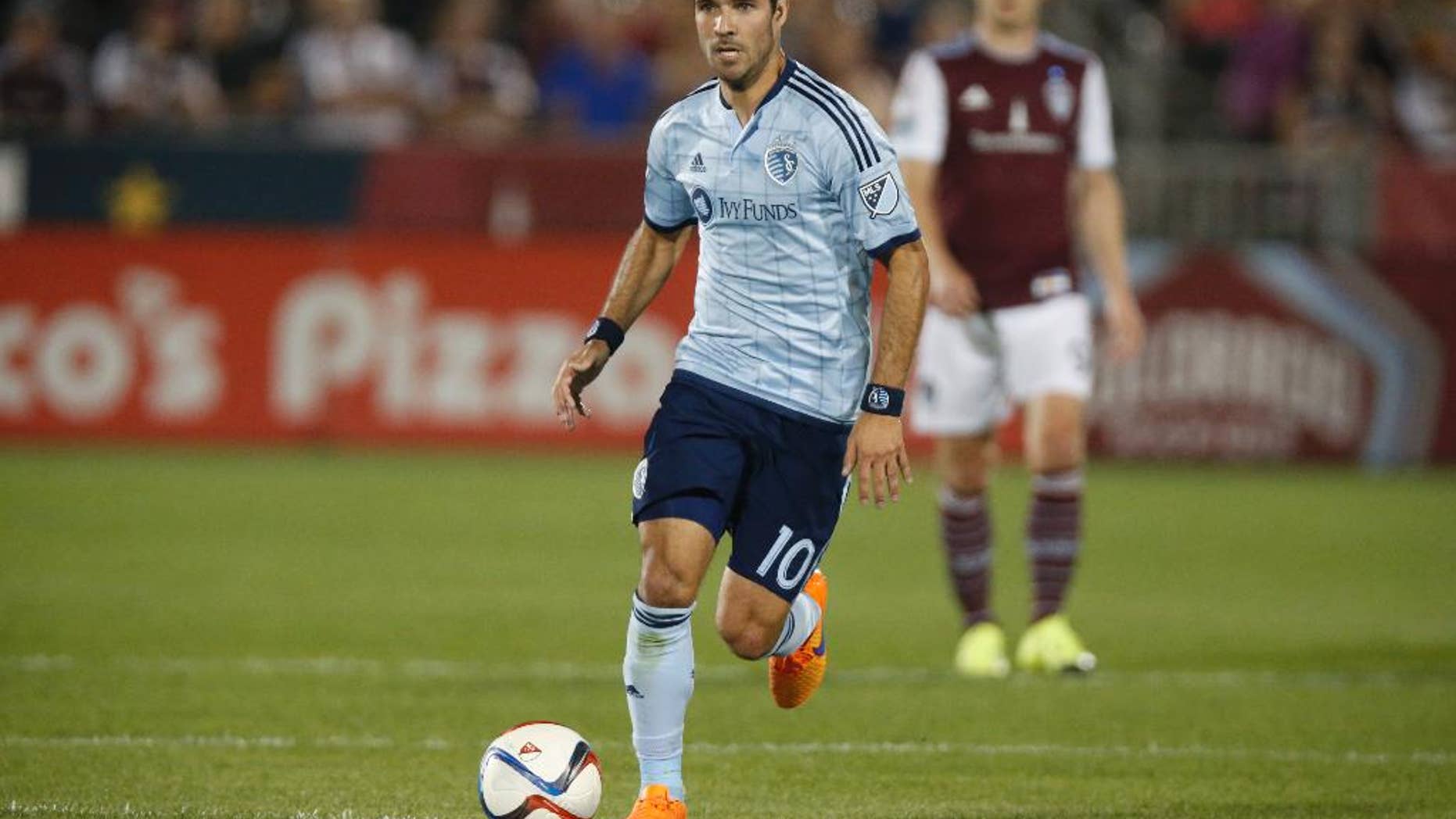 This Aug. 29, 2015 photo shows Sporting KC midfielder Benny Feilhaber (10) in the second half of an MLS soccer match in Commerce City, Colo. Feilhaber is one of several veteran players who thought their U.S. national team careers were over until they got a second shot under new coach Bruce Arena. After a January training camp, the revamped roster begins ramping up for key World Cup qualifiers with an exhibition against Serbia on Sunday in San Diego. (AP Photo/David Zalubowski)