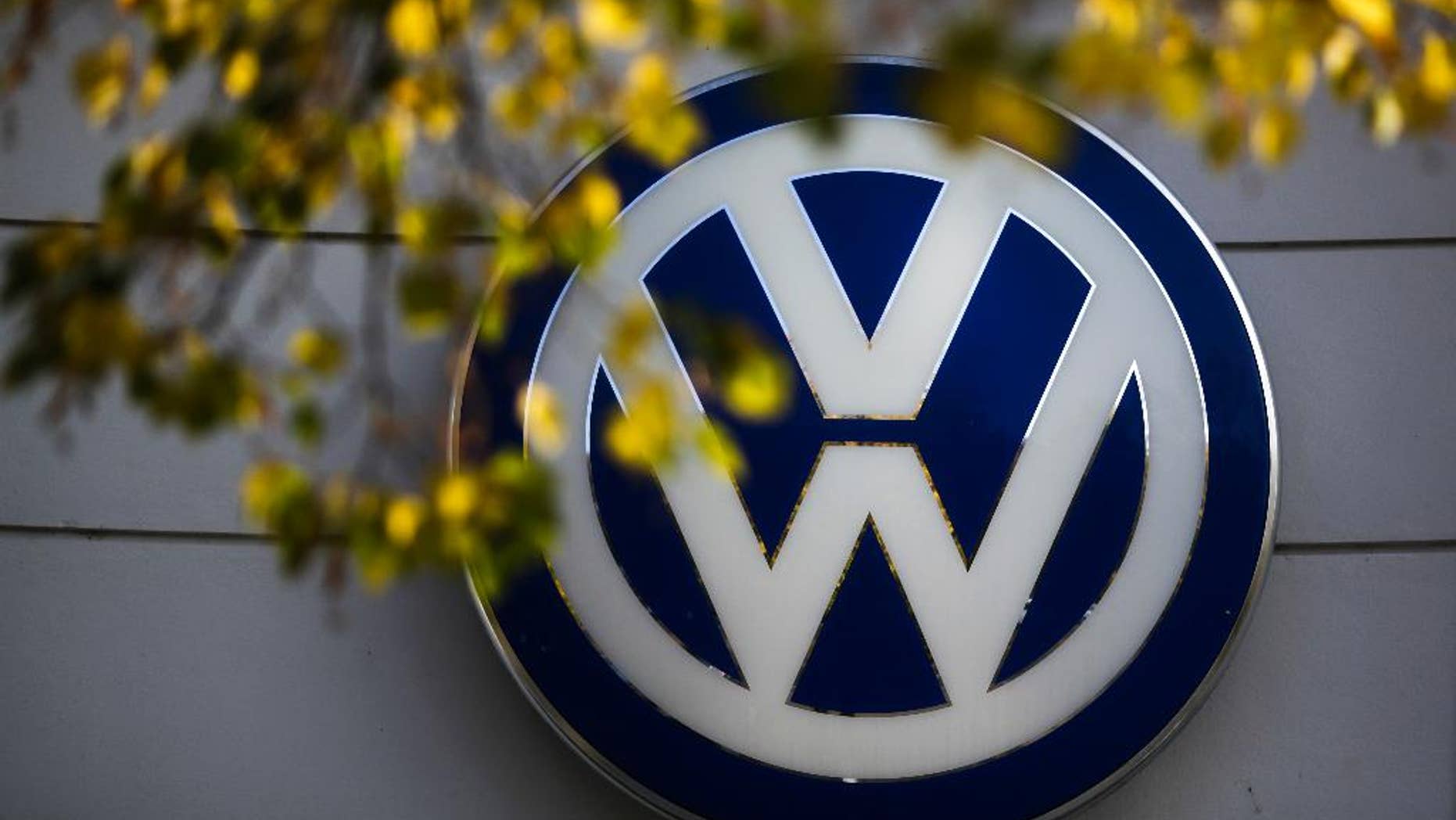 FILE - In this Oct. 5, 2015, file photo, the VW sign of Germany's Volkswagen car company is displayed at the building of a company's retailer in Berlin. A member of Volkswagen's supervisory board is calling for a quick solution to a legal dispute between the automaker and two suppliers that has forced VW to suspend production of some models at German plants, affecting nearly 28,000 workers. (AP Photo/Markus Schreiber, File)