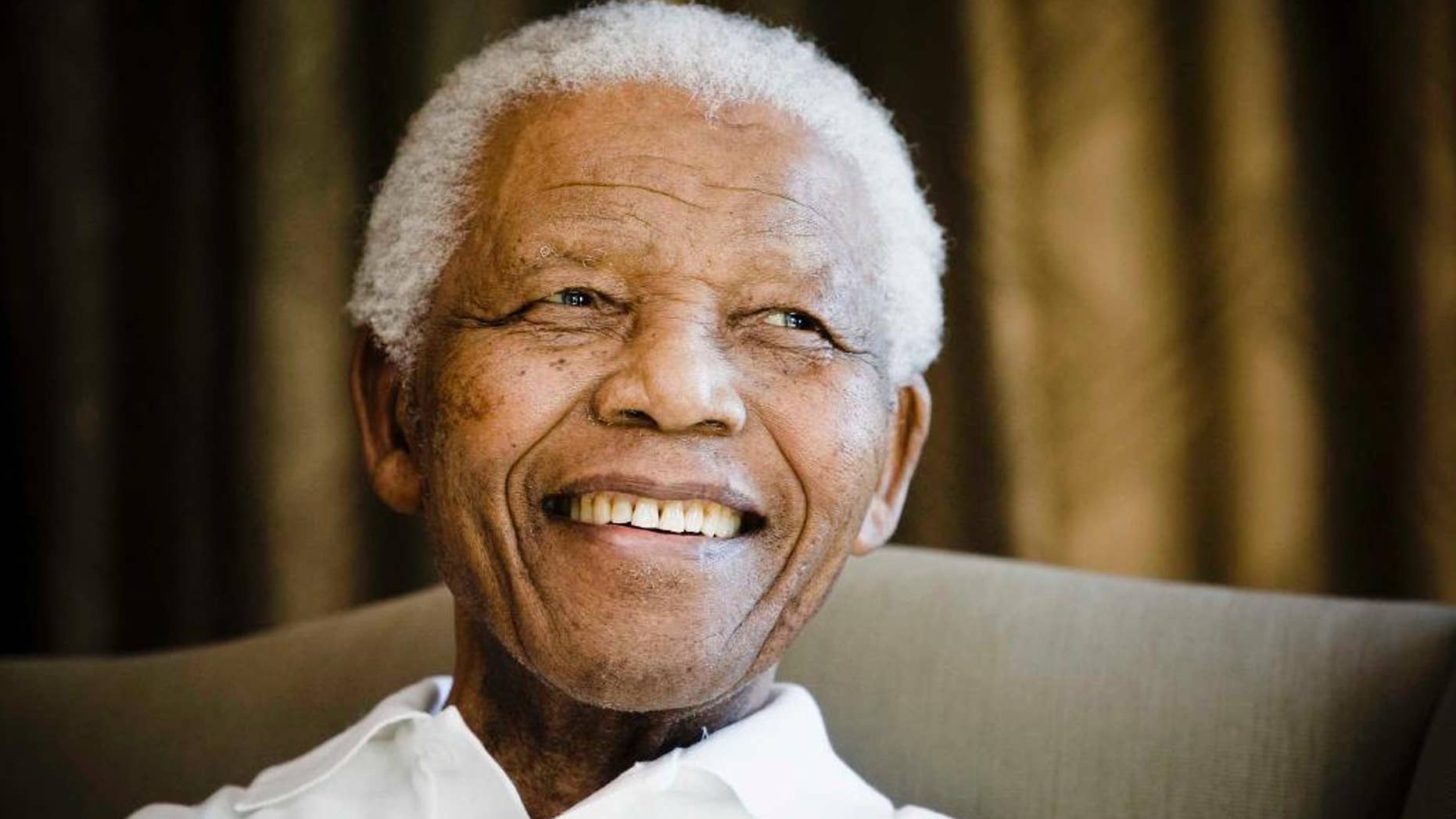 June 2, 2009: Former South African President Nelson Mandela smiles during a meeting with a group of American and South African students in Johannesburg.