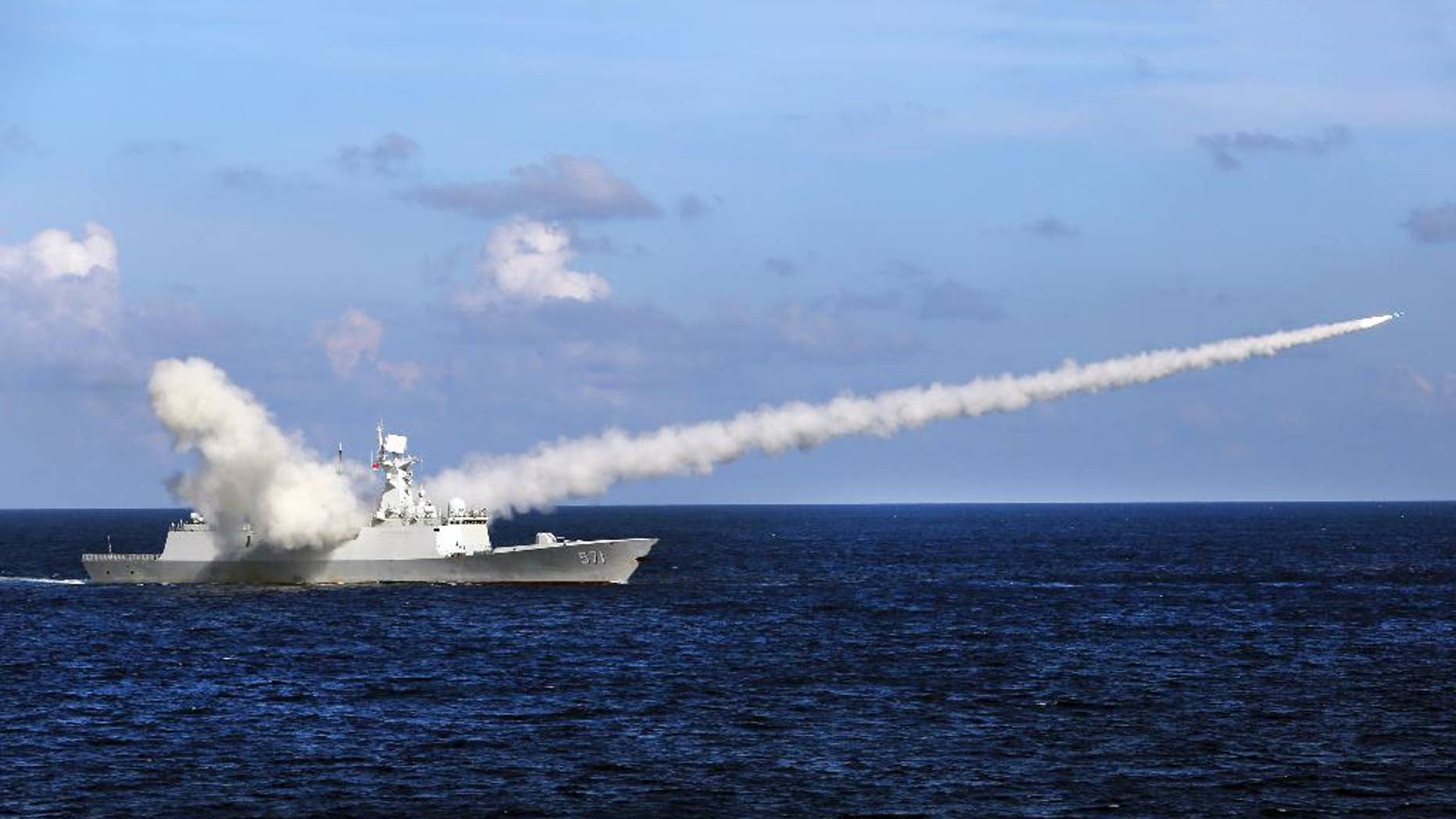 In this Friday, July 8, 2016 photo released by Xinhua News Agency, Chinese missile frigate Yuncheng launches an anti-ship missile during a military exercise in the waters near south China's Hainan Island and Paracel Islands. They are controlled by Beijing but also claimed by Vietnam and Taiwan. China's navy is holding a week of military drills around the disputed islands ahead of a ruling by an international tribunal in a case filed by the Philippines challenging China's claim to most of the South China Sea. China is boycotting the case before The Hague-based court and says it will not accept the verdict. (Zha Chunming/Xinhua via AP)