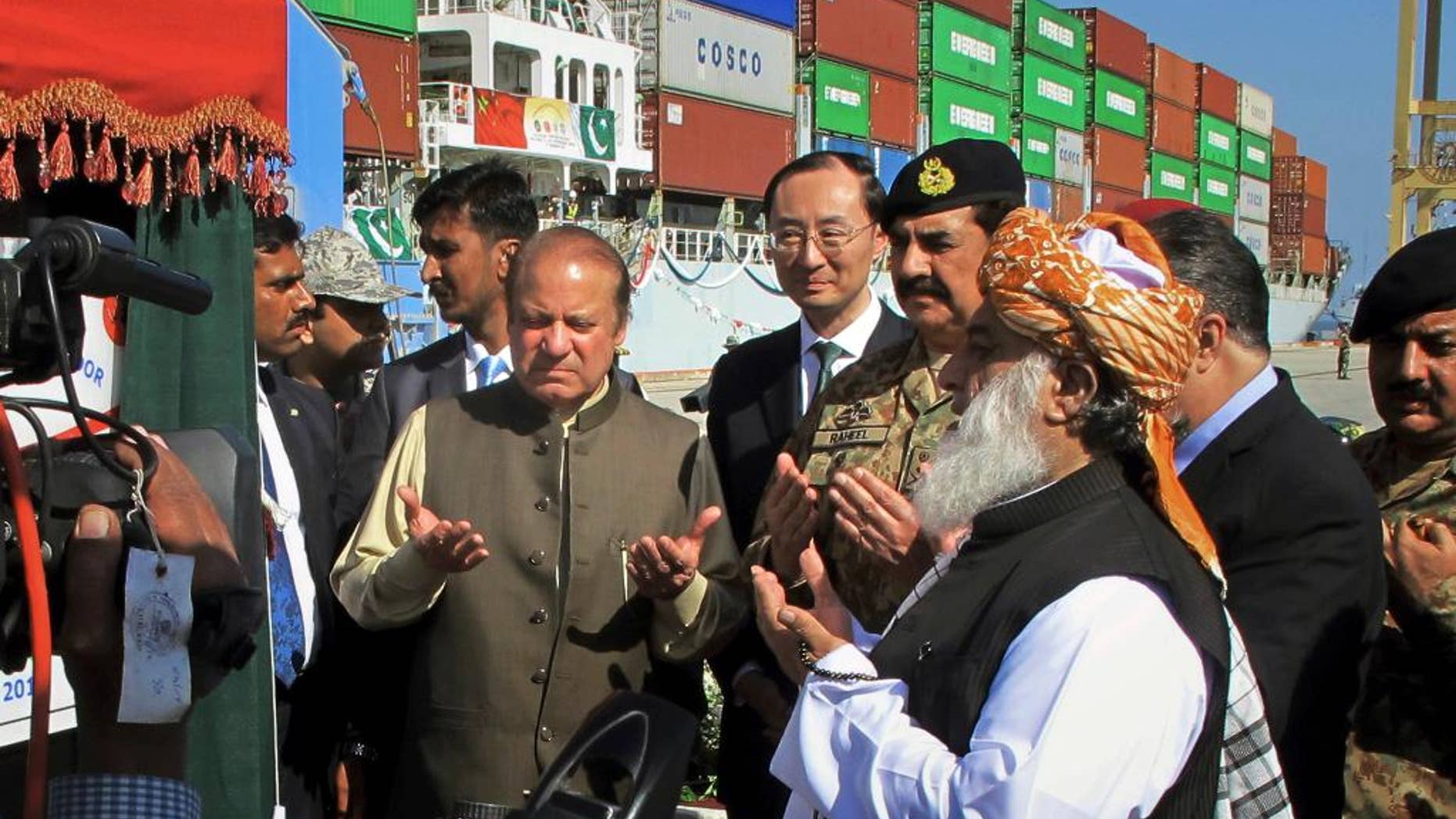 Image result for Prime Minister Nawaz Sharif of Pakistan, center left, praying during the formal opening of Gwadar port in 2016. Credit Muhammad Yousuf/Associated Press