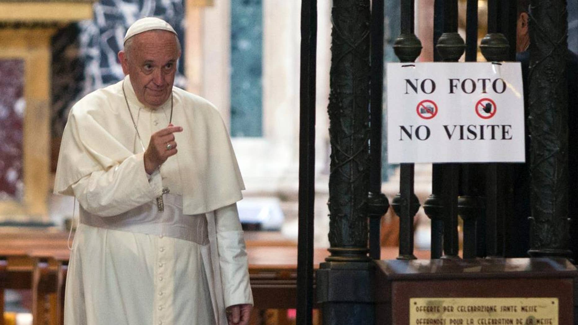Pope Francis leaves after paying a visit to the St. Mary Major Basilica in Rome, Monday, July 13, 2015. Pope Francis landed in Rome Monday after a week-long trip to South America, including Ecuador, Bolivia and Paraguay. (AP Photo/Riccardo De Luca)