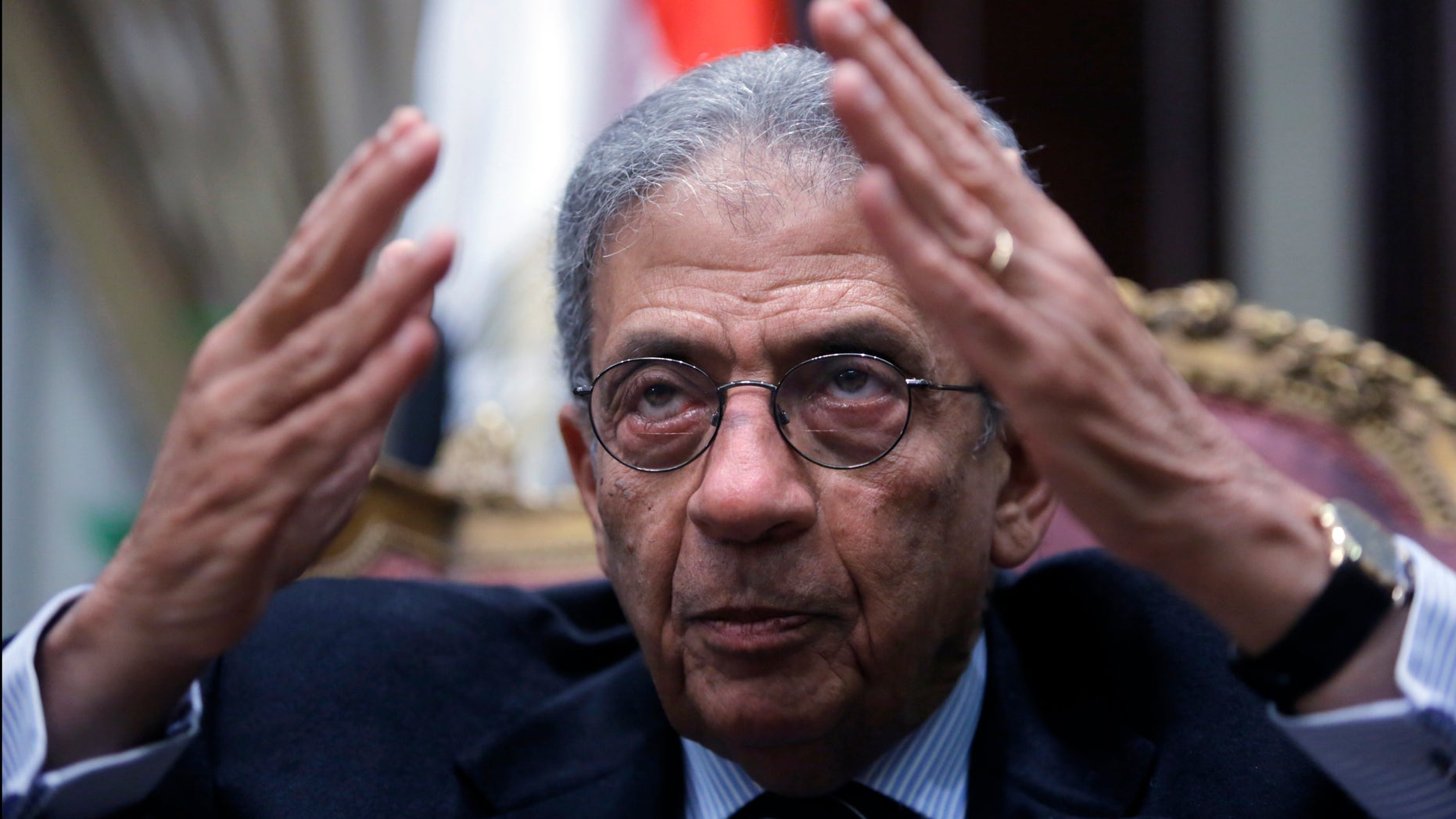 Amr Moussa, the chairman of Egypt's 50-member panel tasked with amending its Islamist-drafted constitution, talks during an interview with The Associated Press at the Shoura Council in Cairo, Egypt, Tuesday, Dec. 10, 2013. Egypt’s veteran diplomat and liberal politician Moussa said a constitution drafted by a 50-member panel he chaired will offer unprecedented guarantees for democracy, individual freedoms and gender equality. (AP Photo/Amr Nabil)