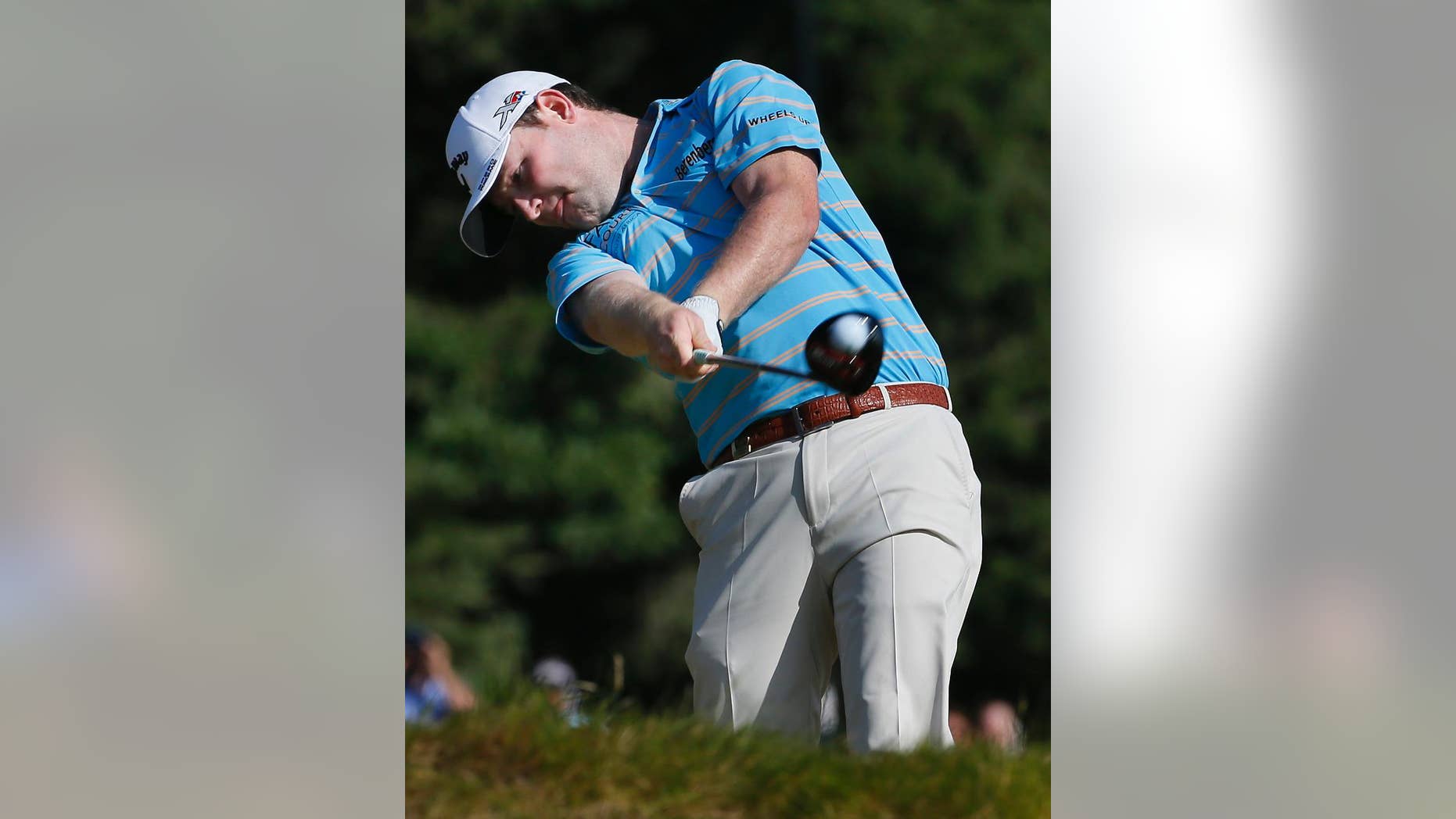 Branden Grace, of South Africa, hits his tee shot on the 14th hole during the third round of the U.S. Open golf tournament at Chambers Bay on Saturday, June 20, 2015 in University Place, Wash. (AP Photo/Matt York)