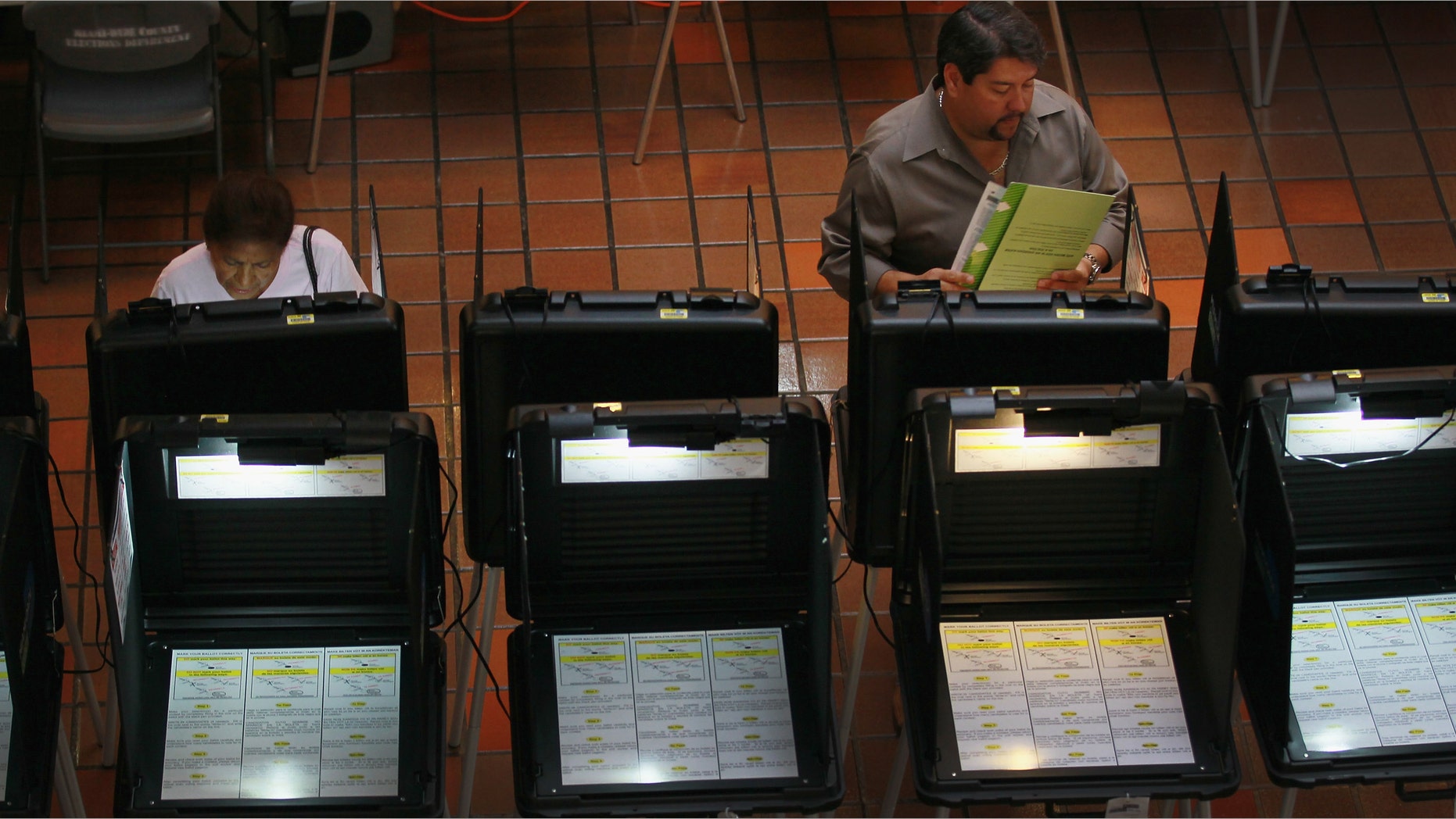 MIAMI, FL - MAY 09: Early voters fill out their ballots as they cast their votes before the general election date scheduled for May 24th, during the special election to select a new Miami-Dade mayor on May 9, 2011 in Miami, Florida. The former mayor Carlos Alvarez was voted out of office by voters unhappy with a property tax rate increase and the fact that he gave salary raises to county employees during a deep recession. The vote to oust the former mayor made Miami-Dade the most populous area ever to recall a local official. 11 candidates are running for the open seat. (Photo by Joe Raedle/Getty Images)
