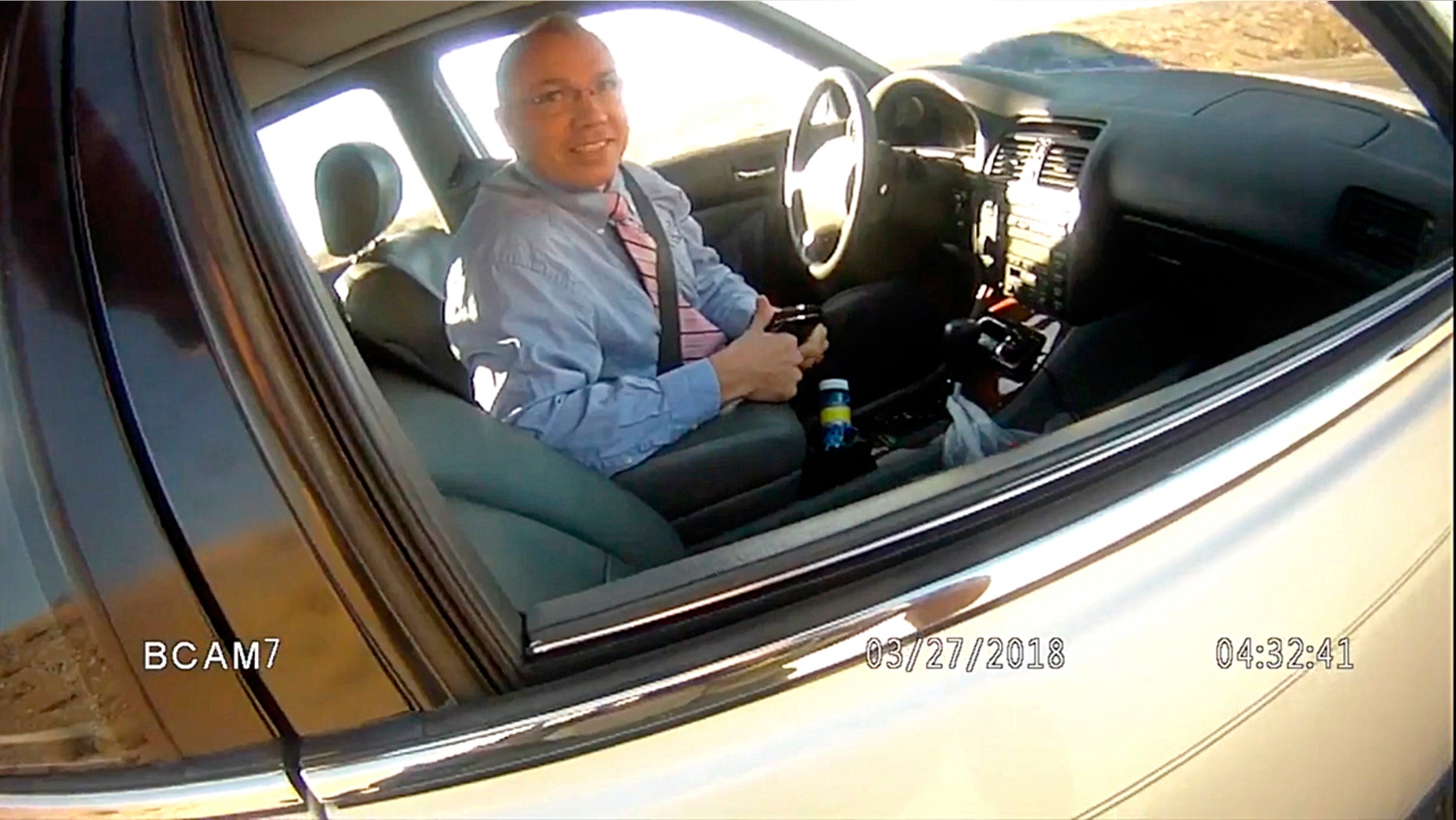 This image made from a law enforcement body camera video shows Arizona state Rep. Paul Mosley during a traffic stop outside Parker, Ariz., March 27, 2018.
