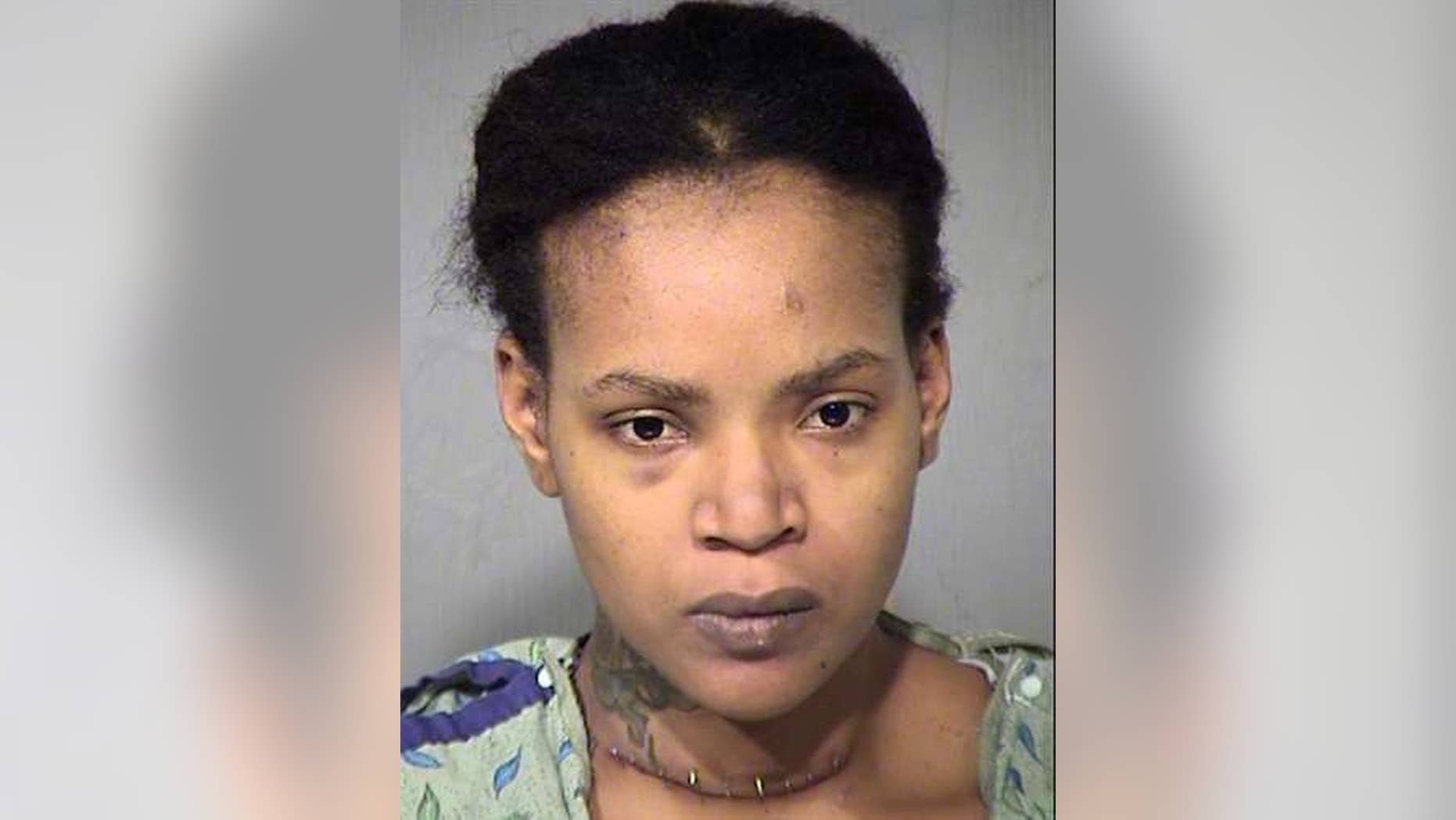 This undated booking photo provided by the Maricopa County Sheriff shows Octavia Renee Rogers who was booked into jail Sunday, June 5, on suspicion of three counts of first-degree murder. Rogers is accused of stabbing her three young sons to death and wounding herself. (Maricopa County Sheriff via AP)