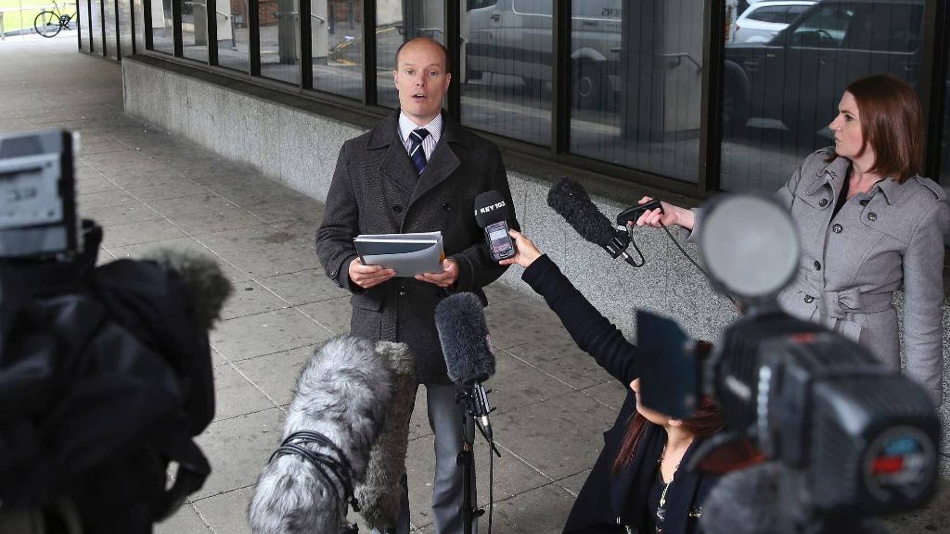 Ben Southam, Senior Crown Prosecutor from the CPS North West Complex Casework Unit, talks to the media outside Manchester Crown Court, Manchester England, Monday, May 18, 2015, after nurse Victorino Chua was found guilty by a jury of murdering and poisoning hospital patients at Stepping Hill Hospital. A medical mystery that began four years ago with unexplained deaths in a British hospital ended Monday when a “frustrated” nurse was convicted of using insulin to murder two patients. The 49-year-old nurse, a father of two daughters, was also convicted of trying to poison 20 other patients during what police called a reign of terror at Stepping Hill Hospital in Stockport, 200 miles (320 kilometers) northwest of London. (Peter Byrne/PA via AP) UNITED KINGDOM OUT