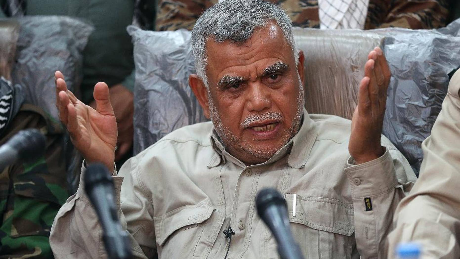 Iraqi militia leader Hadi al-Amiri speaks to the press in Samarra, Iraq 95 kilometers (60 miles) north of Baghdad, Iraq, Wednesday, March 25, 2015. Al-Amiri insisted that the Popular Mobilization Unit, which consists of various militias, does not need assistance from coalition forces to retake the militant-held city of Tikrit. The U.S. and Iraq have been discussing possible U.S. airstrikes in support of a stalled Iraqi ground offensive against a dug-in Islamic State force in Tikrit, U.S. officials said Wednesday. The prospect of U.S. airstrikes in Tikrit raises highly sensitive questions about participating in an Iraqi campaign that has been spearheaded by Iraqi Shiite militias trained and equipped by Iran, an avowed U.S. adversary. (AP Photo/Karim Kadim)