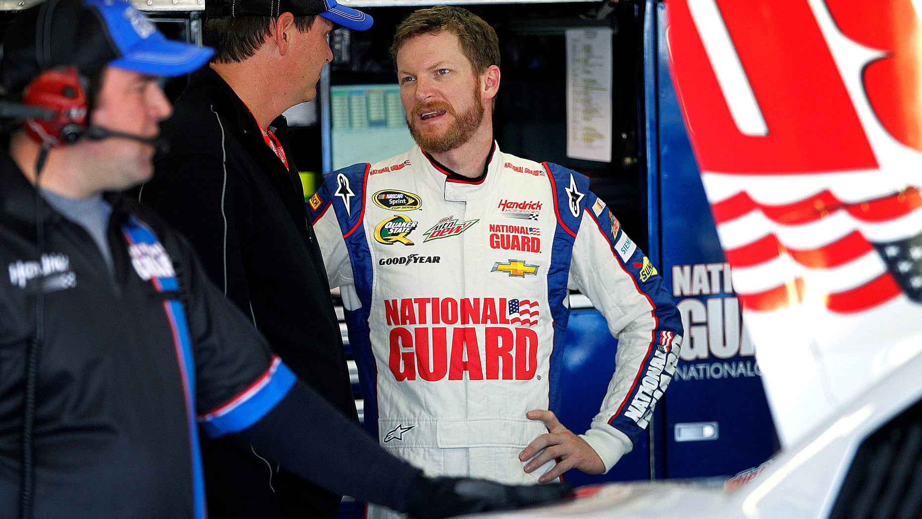 Dale Earnhardt Jr., talks with his team during testing at Texas Motor Speedway, Thursday, April 11, 2013, in Fort Worth,Texas. The NASCAR Sprint Cup Series NRA 500 auto race is scheduled to run Saturday, April 13. (AP Photo/The Fort Worth Star-Telegram, Ron Jenkins) MAGS OUT; (FORT WORTH WEEKLY, 360 WEST); INTERNET OUT