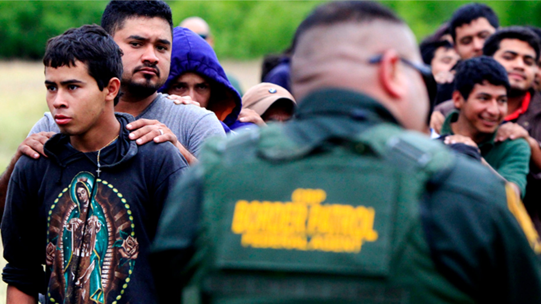 April 17, 2014: Suspected illegal immigrants being detained by U.S. Border Patrol agents, in McAllen, Texas.