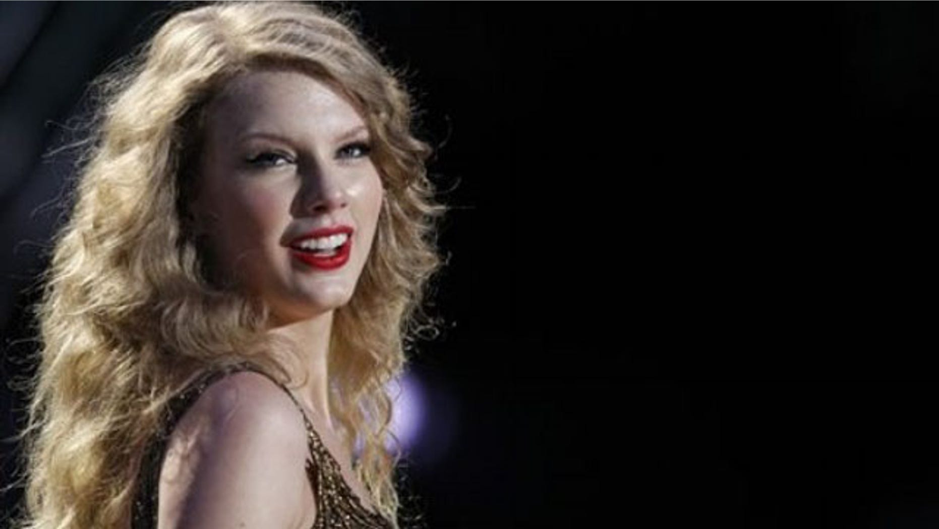 In this Sunday, June 12, 2011, file photo, Taylor Swift performs during the CMA Fan Fest in Nashville, Tenn. For the first time in her career, Swift had to postpone her Saturday, July 2, 2011, sold-out show at the Yum Center in Louisville under doctor's orders due to illness. (AP Photo/Wade Payne, File)