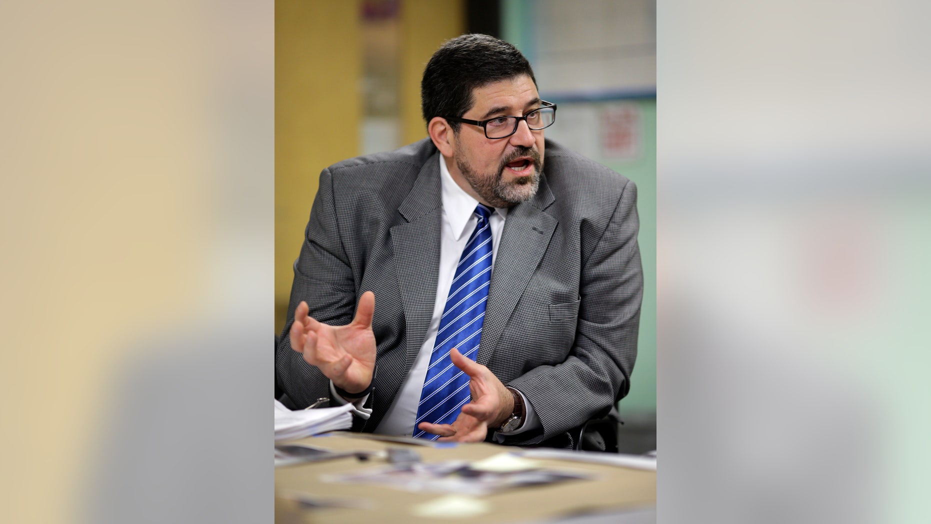 In this April 30, 2013 picture, Baltimore City Public Schools CEO Andrés Alonso speaks during an interview with The Associated Press at John Eager Howard Elementary School in Baltimore. The school district announced Monday that Alonso will retire at the end of the current school year after six years of leading the school district. Officials say his retirement is fueled by his desire to return home to New Jersey to care for his aging parents and to assume a professorship at Harvard University. (AP Photo/Patrick Semansky)
