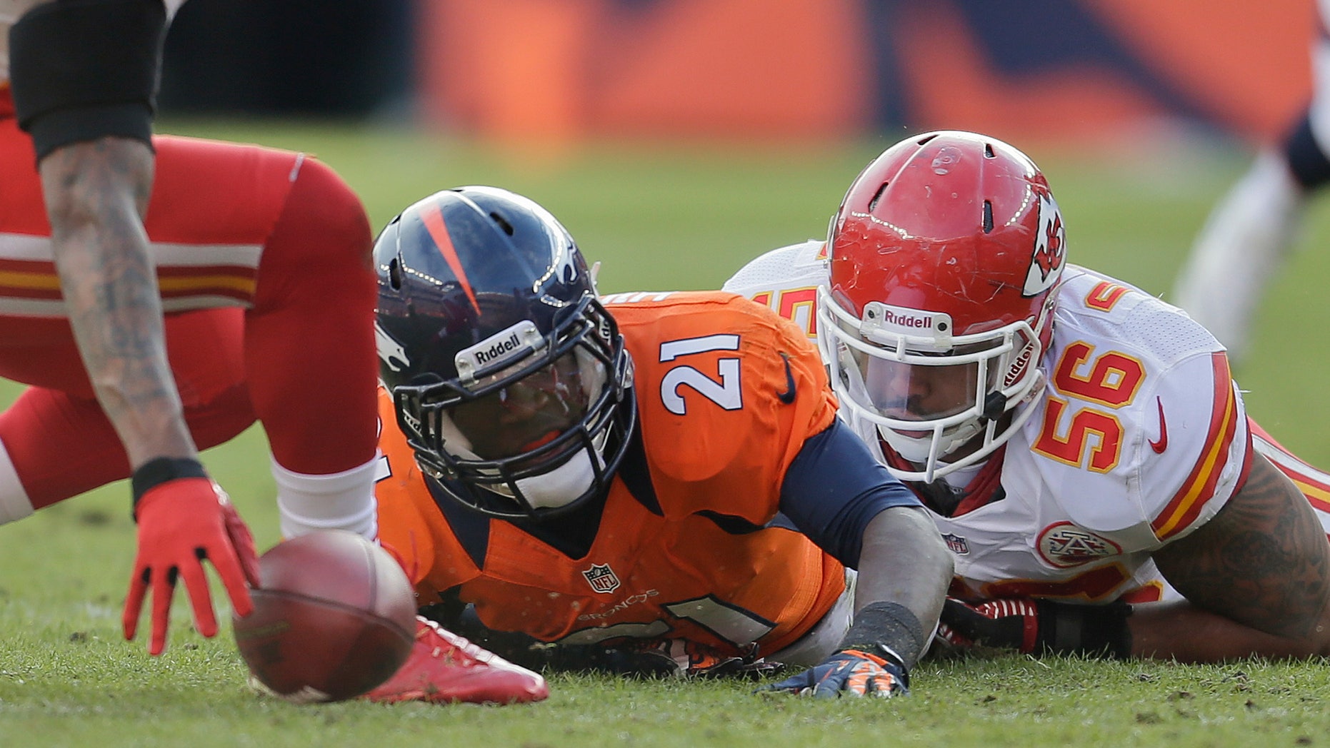 Denver Broncos running back Ronnie Hillman (21) fumbles the ball as he is tackled by Kansas City Chiefs inside linebacker Derrick Johnson (56) in the first quarter of an NFL football game, Sunday, Dec. 30, 2012, in Denver. Kansas City recovered the ball on the play. (AP Photo/Joe Mahoney)