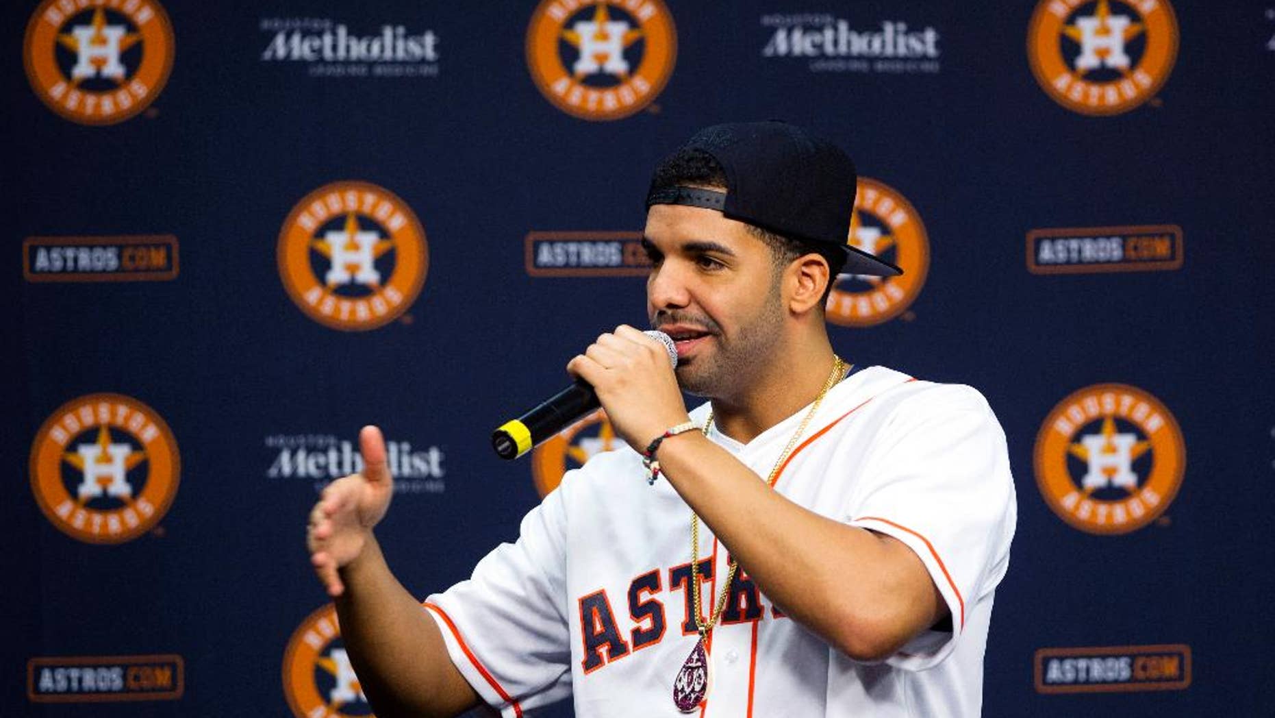 Grammy Award-winning artist Drake speaks at a press conference before a baseball game against the Arizona Diamondbacks and the Houston Astros, Thursday, June 12, 2014, in Houston. (AP Photo/Patric Schneider)