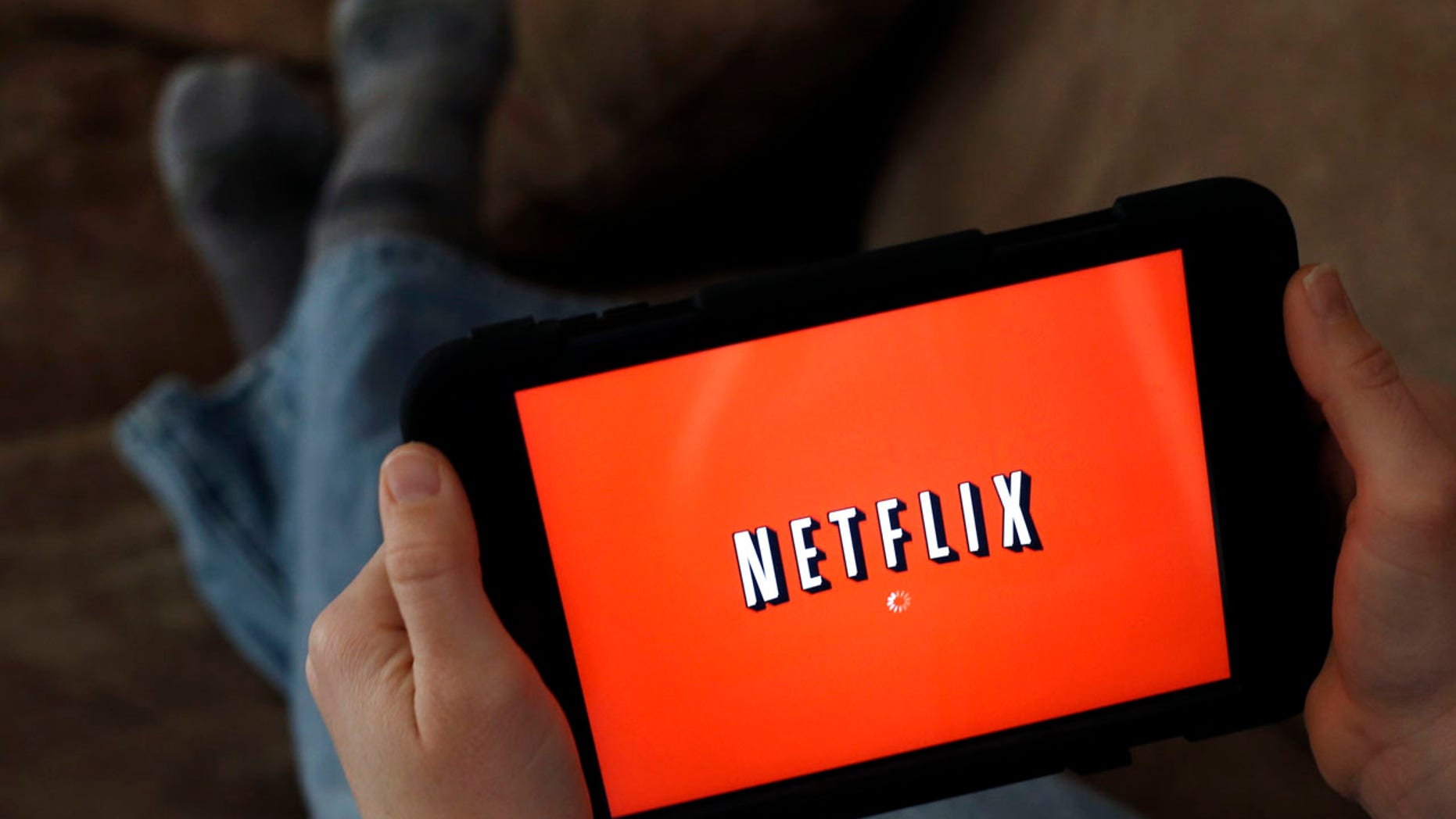 File photo: In this Friday, Jan. 17, 2014, file photo, a person displays Netflix on a tablet in North Andover, Mass. (AP Photo/Elise Amendola)