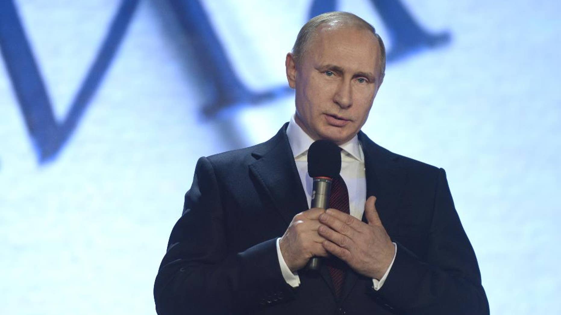 Russian President Vladimir Putin opens a meeting of the Russian Geographical Society in Moscow, Russia, Tuesday, Dec. 9, 2014.(AP Photo/RIA Novosti, Alexei Nikolsky, Presidential Press Service)