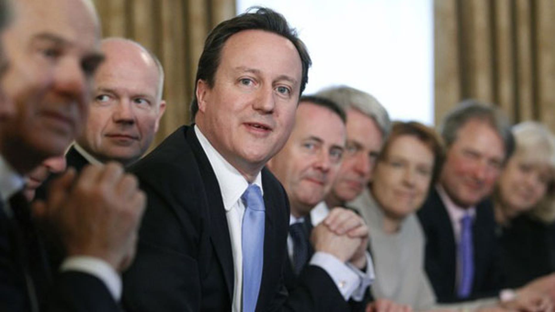 May 13: Britain's Prime Minister, David Cameron, center, leads his first cabinet meeting at number 10 Downing Street in London.