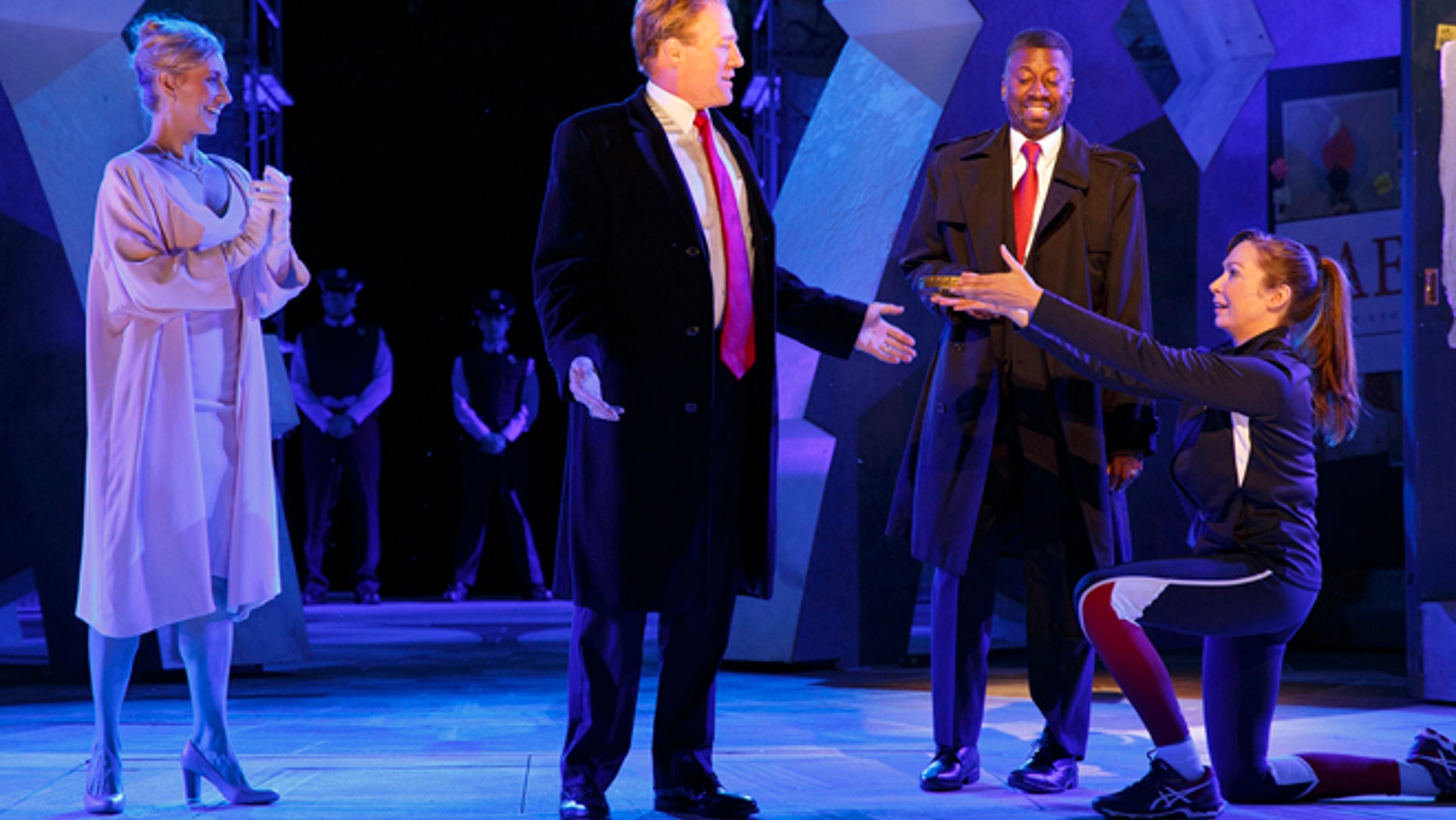 FILE: Tina Benko, left, portrays Melania Trump in the role of Caesar's wife, Calpurnia, and Gregg Henry, center left, portrays President Donald Trump in the role of Julius Caesar during a dress rehearsal of The Public Theater's Free Shakespeare in the Park production of Julius Caesar in New York.